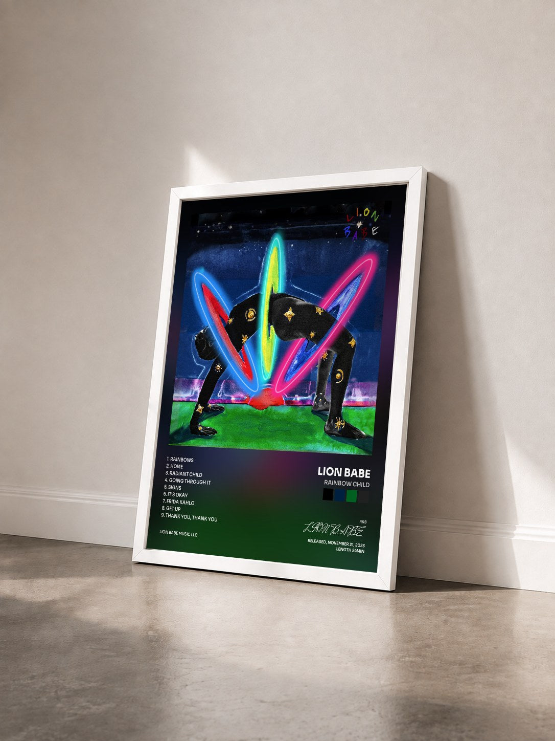 #blanc Tableau de l'album Rainbow Child de LION BABE vu de trois quarts, cadre blanc