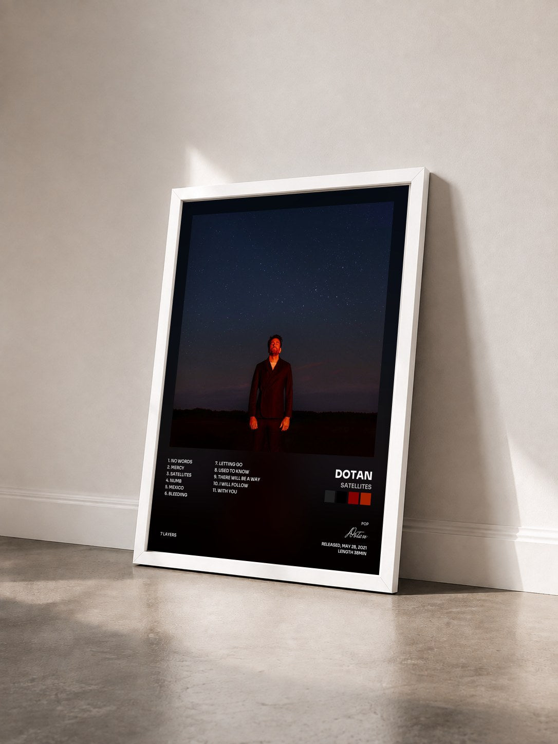 #blanc Tableau de l'album Satellites de Dotan vu de trois quarts, cadre blanc