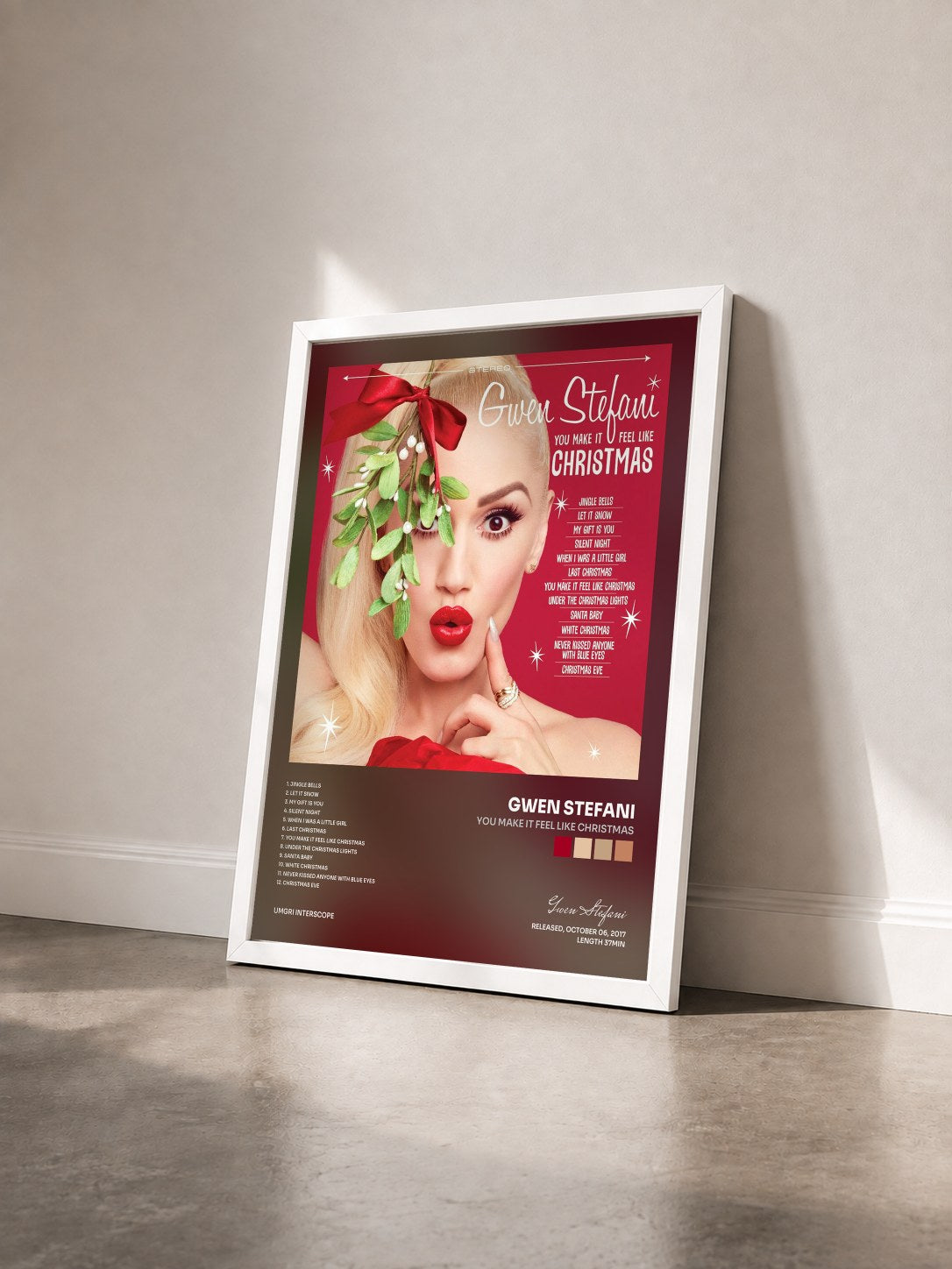 #blanc Tableau de l'album You Make It Feel Like Christmas de Gwen Stefani vu de trois quarts, cadre blanc