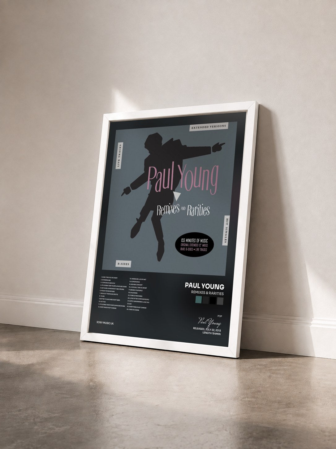#blanc Tableau de l'album Remixes & Rarities de Paul Young vu de trois quarts, cadre blanc