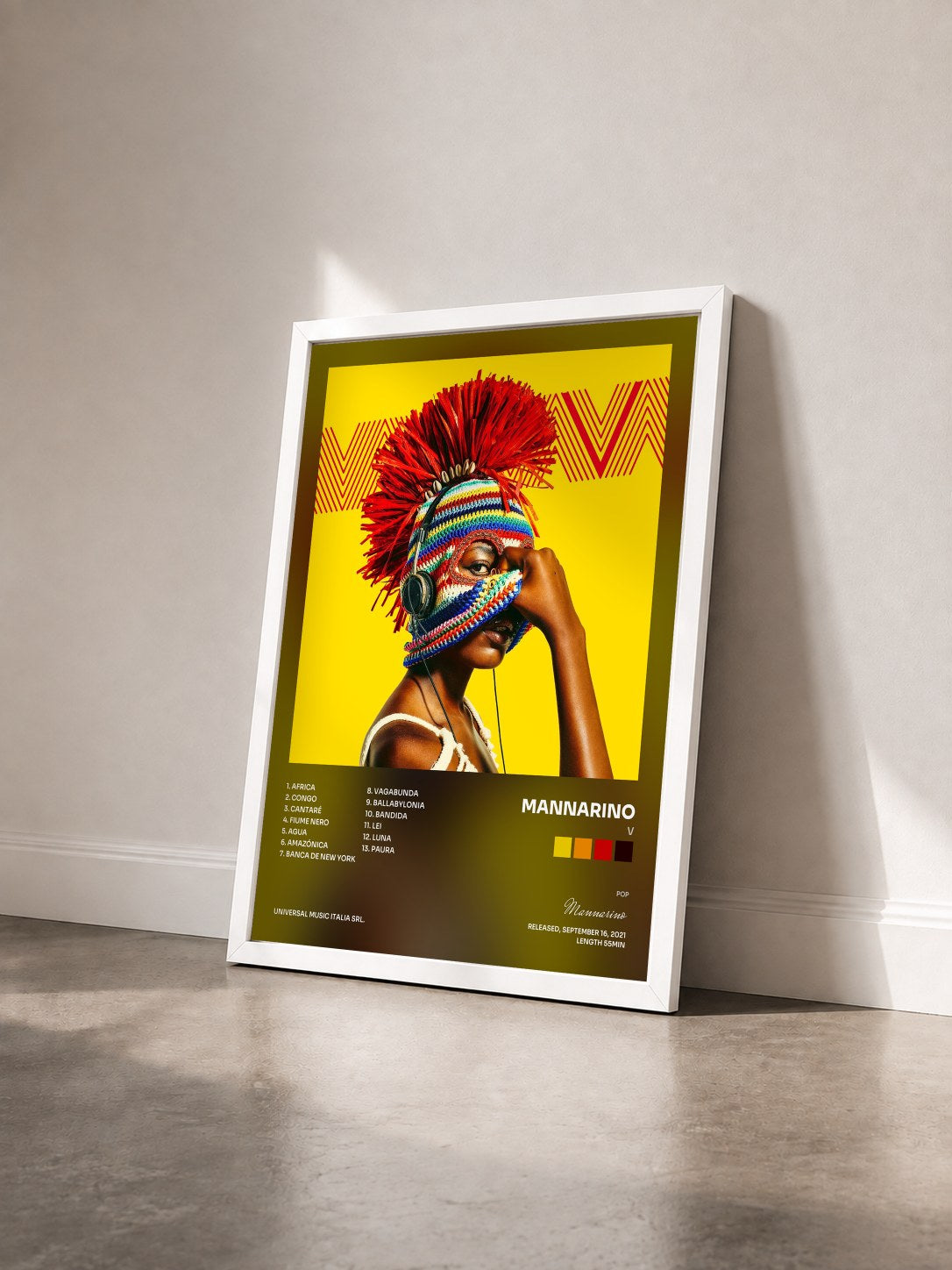 #blanc Tableau de l'album V de Mannarino vu de trois quarts, cadre blanc