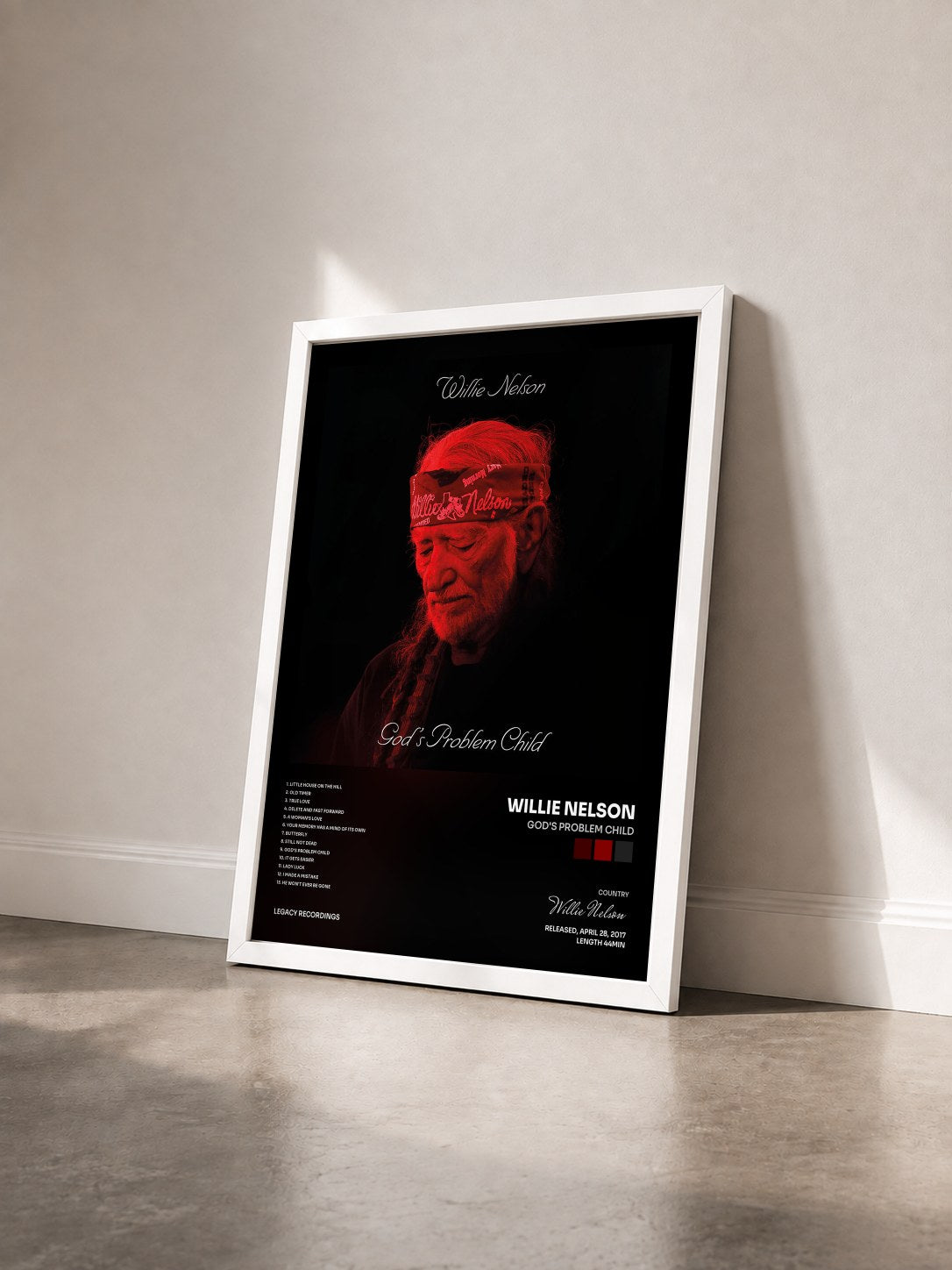#blanc Tableau de l'album God's Problem Child de Willie Nelson vu de trois quarts, cadre blanc