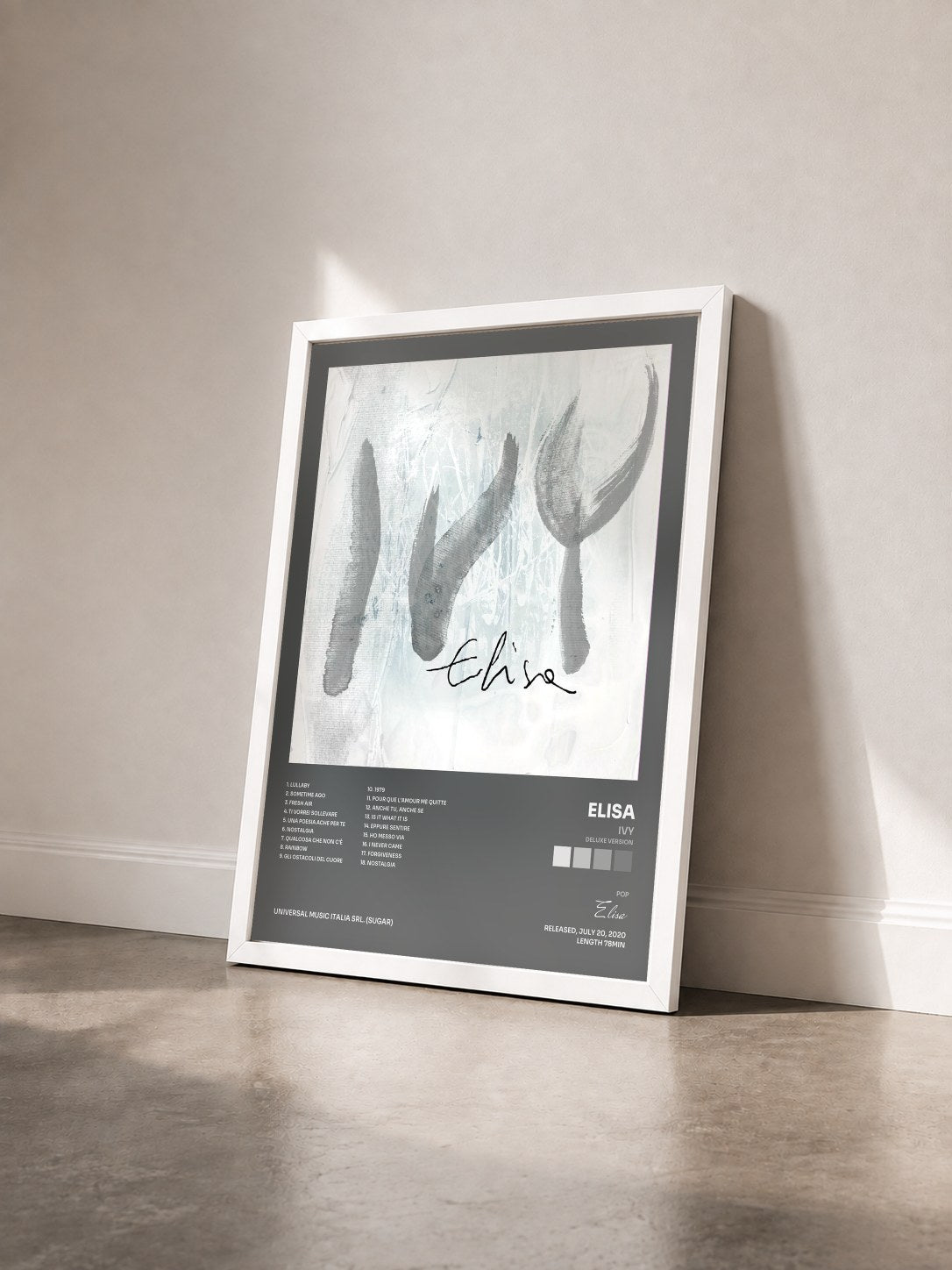 #blanc Tableau de l'album Ivy (Deluxe Version) de Elisa vu de trois quarts, cadre blanc