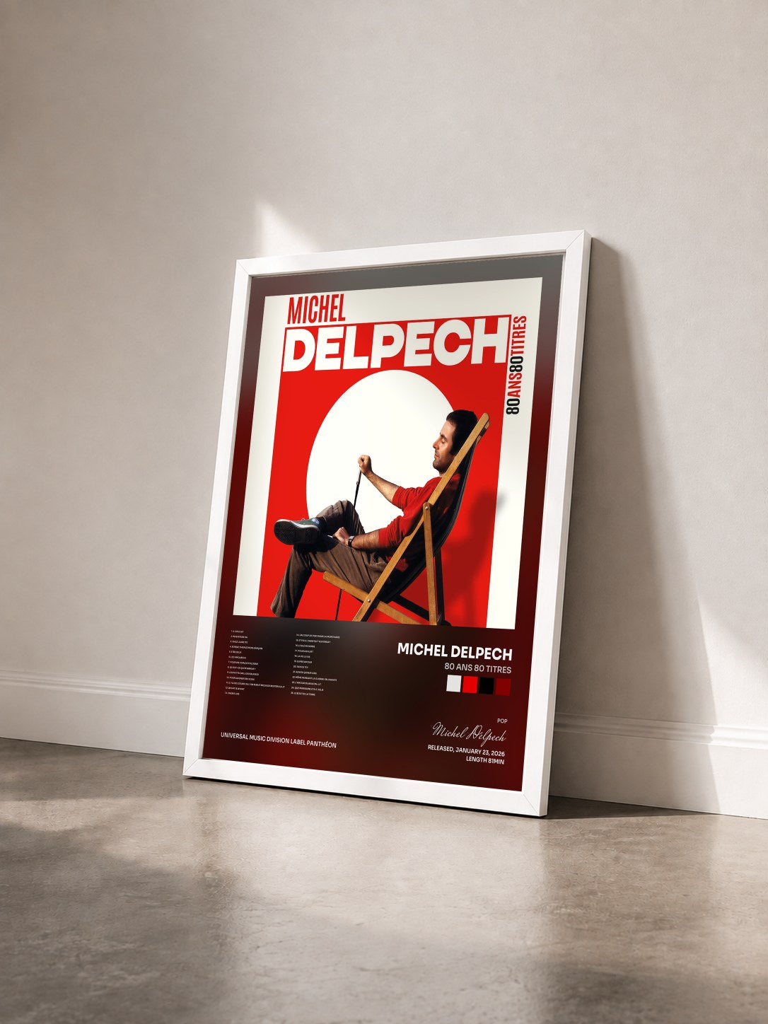 #blanc Tableau de l'album 80 ans 80 titres de Michel Delpech vu de trois quarts, cadre blanc