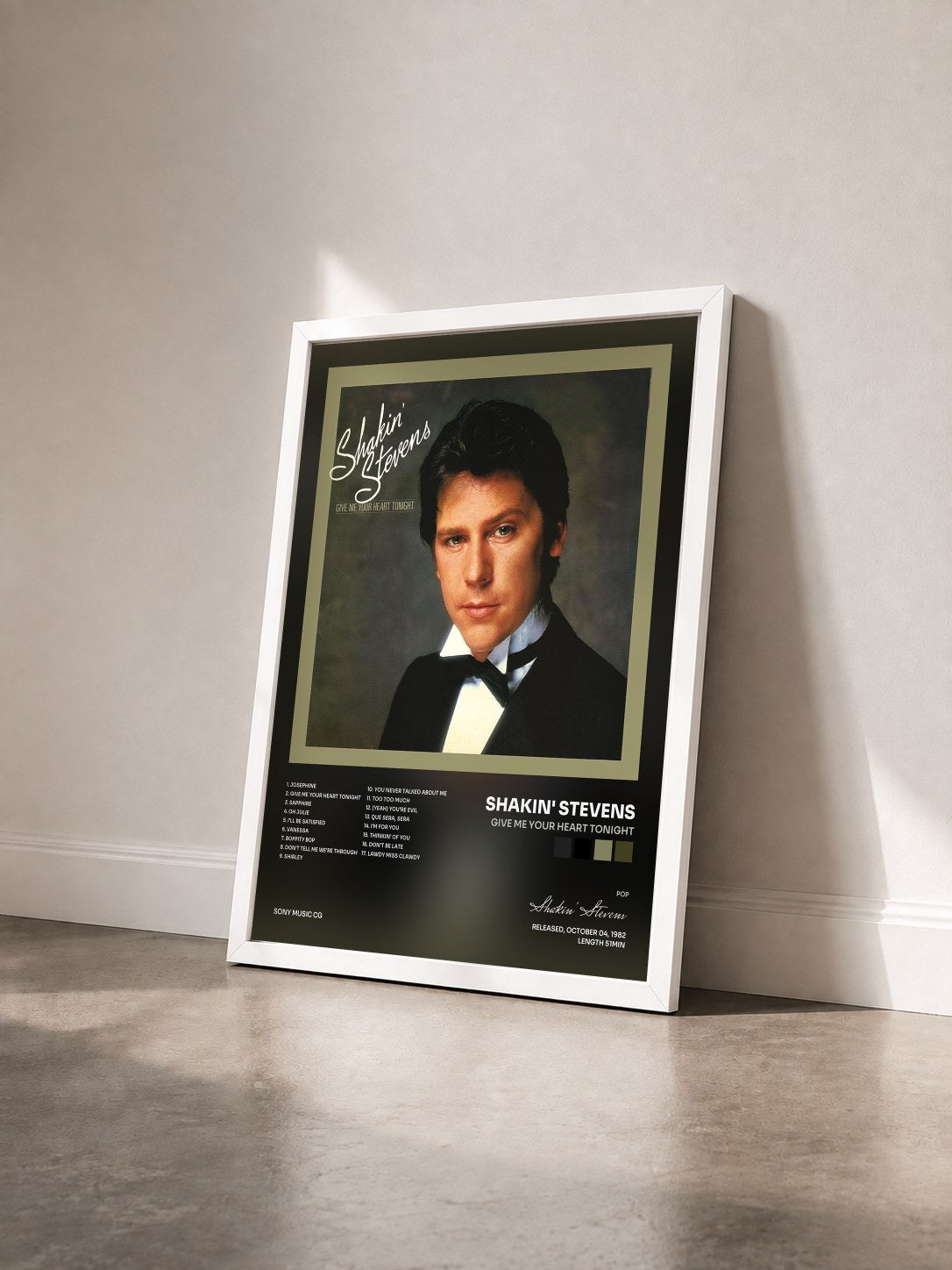 #blanc Tableau de l'album Give Me Your Heart Tonight de Shakin' Stevens vu de trois quarts, cadre blanc