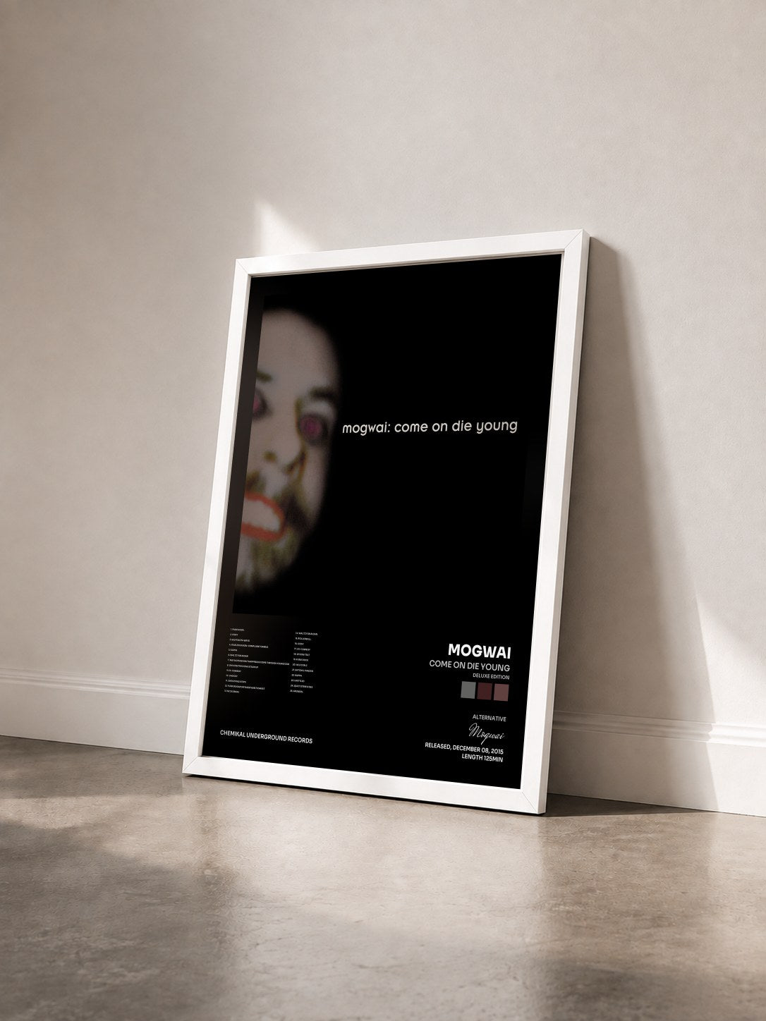 #blanc Tableau de l'album Come on Die Young (Deluxe Edition) de Mogwai vu de trois quarts, cadre blanc