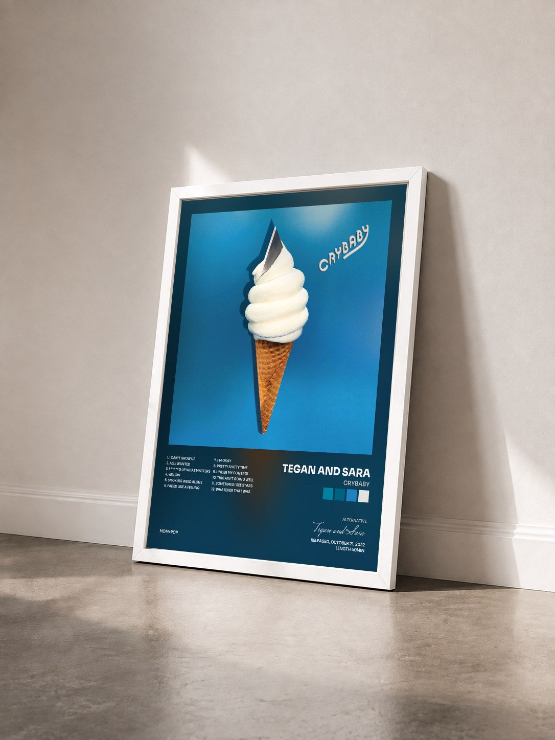 #blanc Tableau de l'album Crybaby de Tegan and Sara vu de trois quarts, cadre blanc