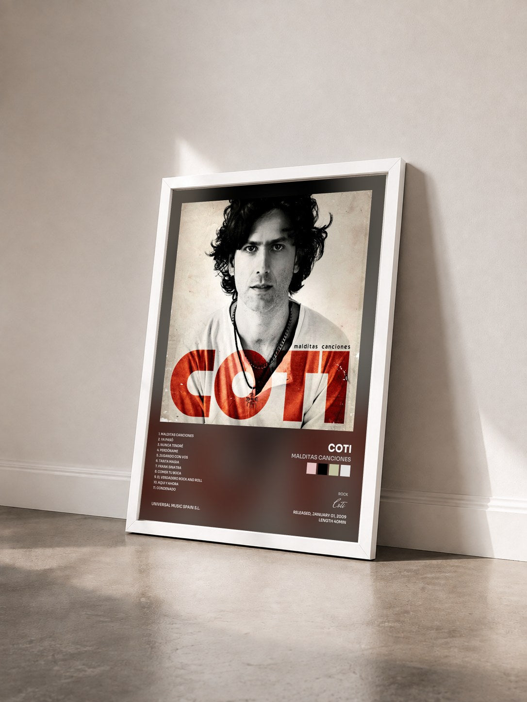 #blanc Tableau de l'album Malditas Canciones de Coti vu de trois quarts, cadre blanc
