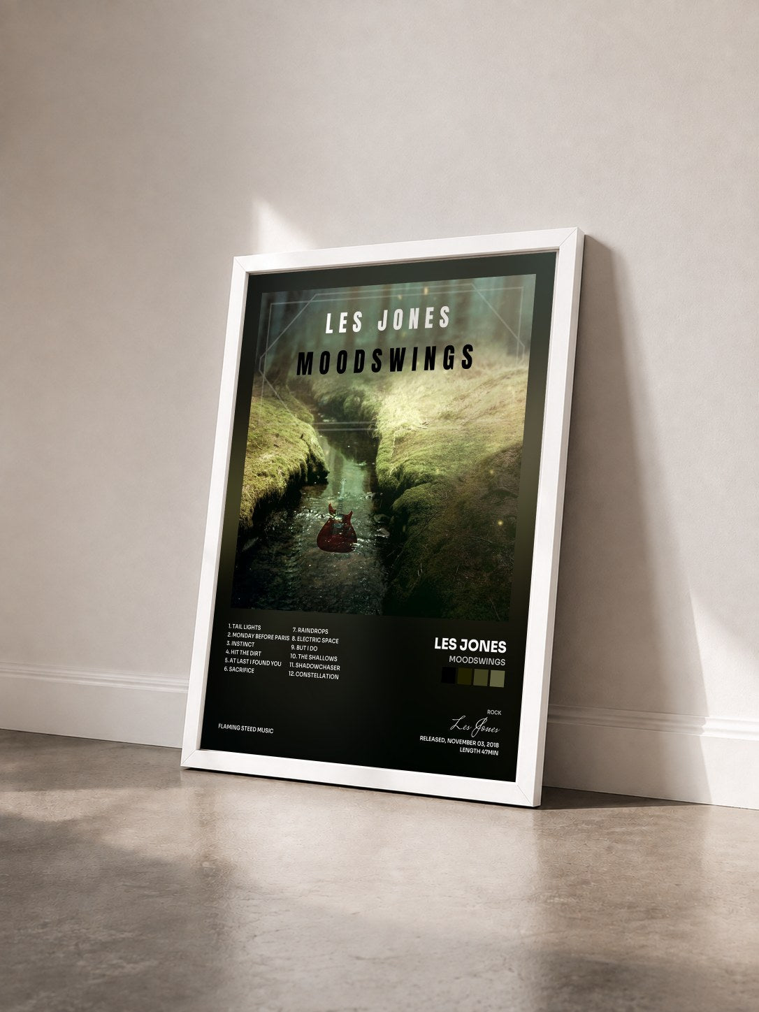 #blanc Tableau de l'album Moodswings de Les Jones vu de trois quarts, cadre blanc