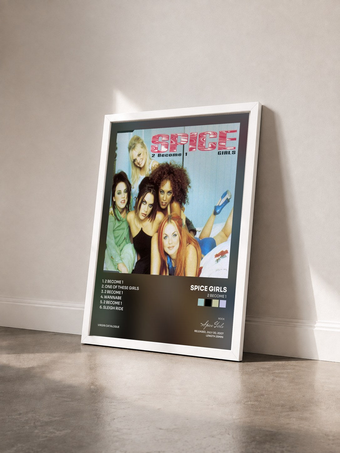 #blanc Tableau de l'album 2 Become 1 de Spice Girls vu de trois quarts, cadre blanc