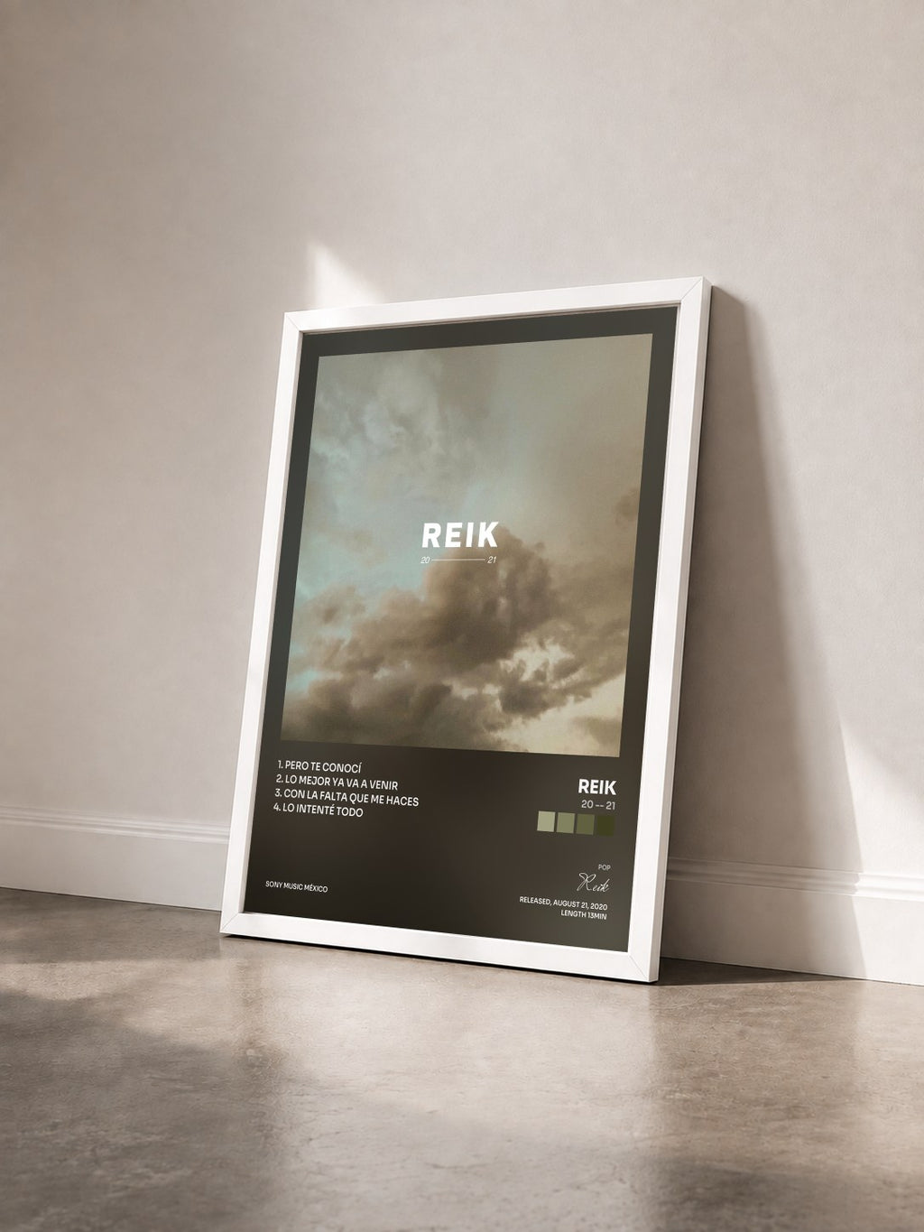 #blanc Tableau de l'album 20 -- 21 de Reik vu de trois quarts, cadre blanc