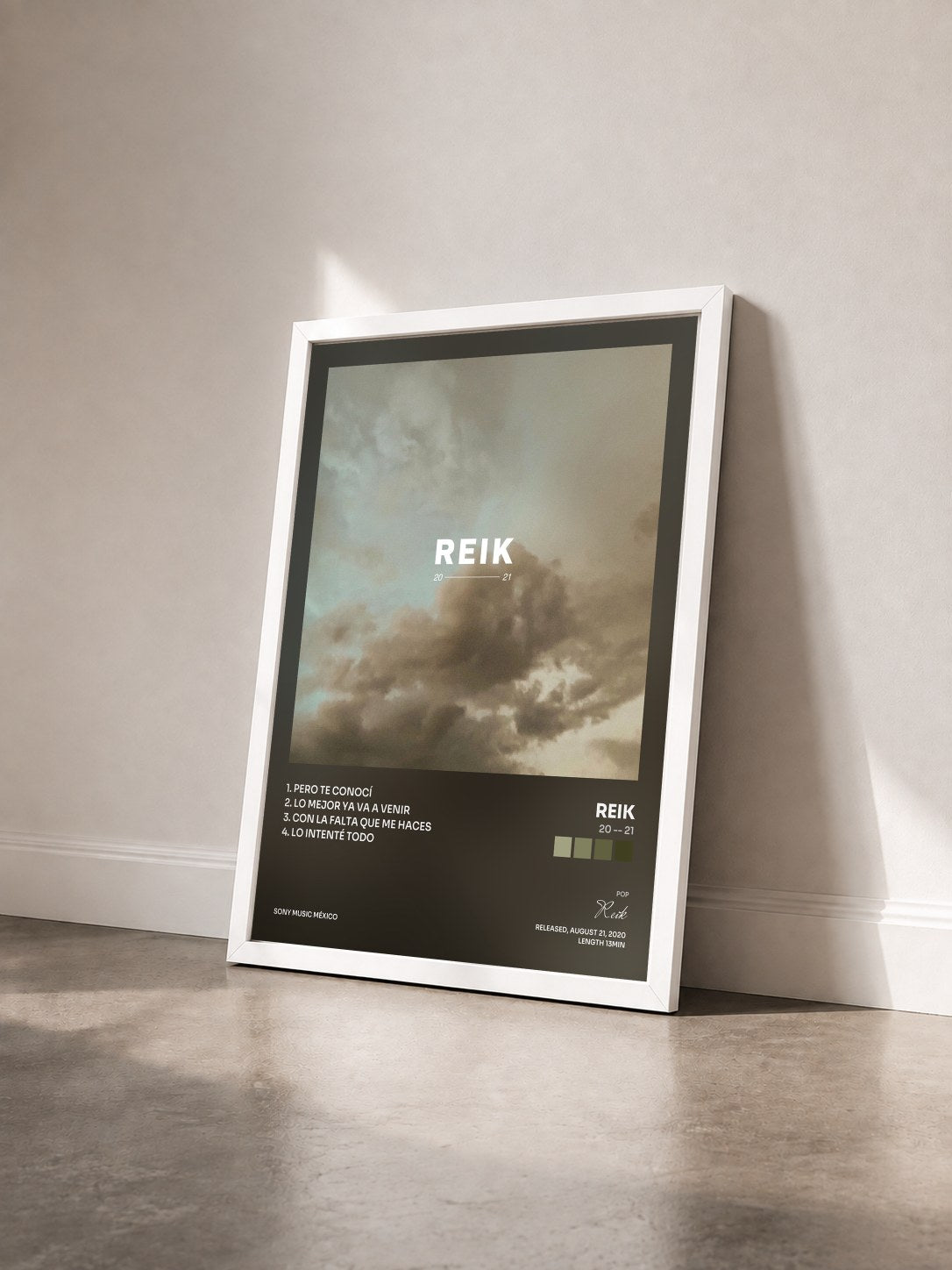 #blanc Tableau de l'album 20 -- 21 de Reik vu de trois quarts, cadre blanc