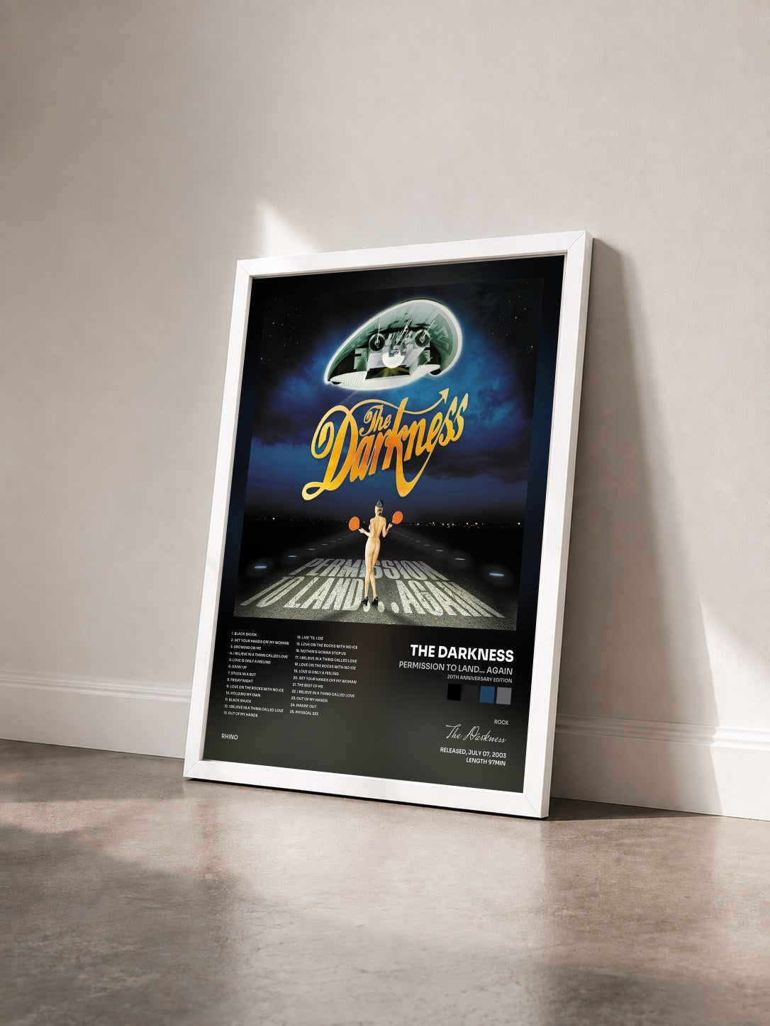 #blanc Tableau de l'album Permission To Land... Again (20th Anniversary Edition) de The Darkness vu de trois quarts, cadre blanc