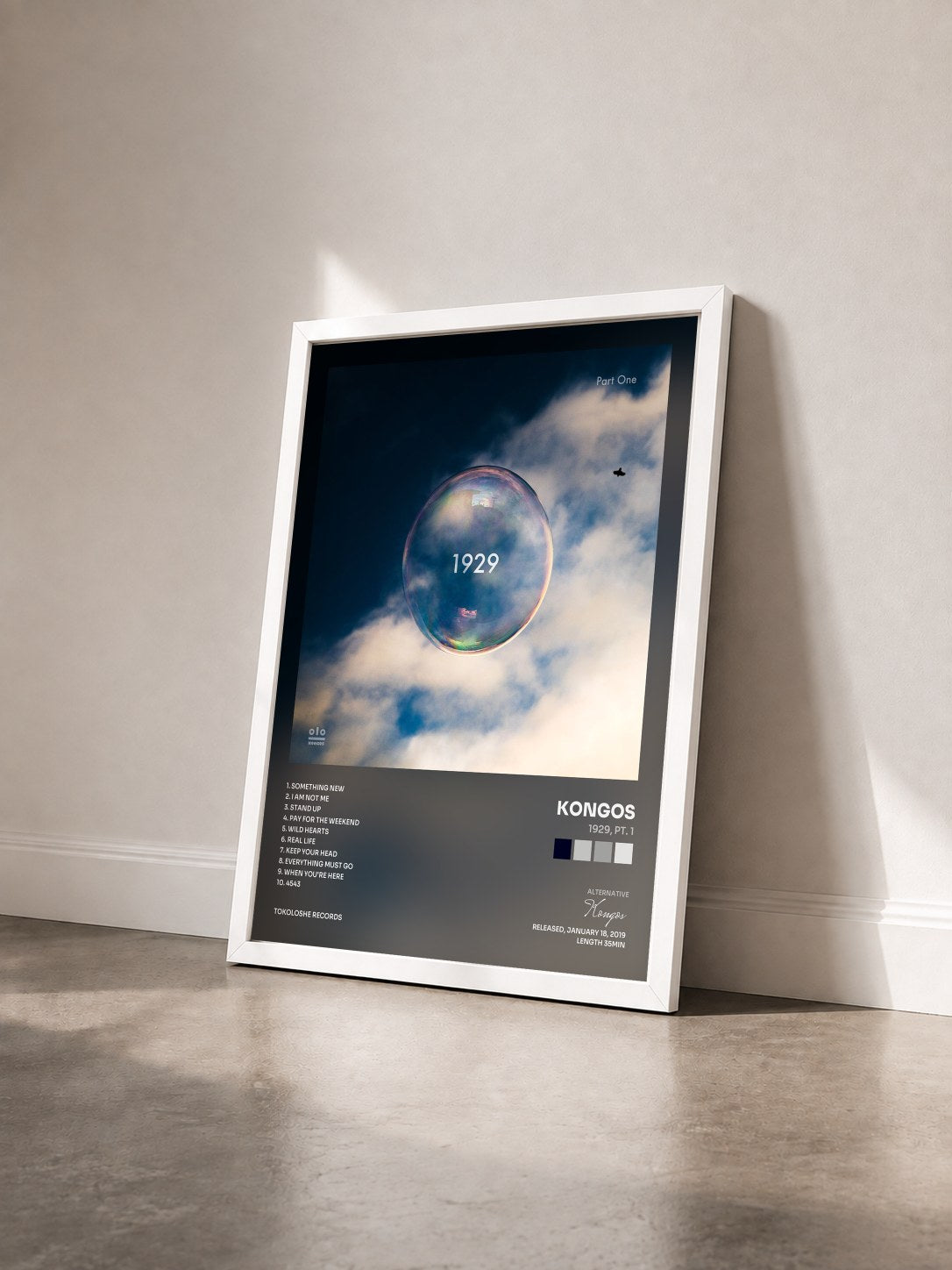 #blanc Tableau de l'album 1929, Pt. 1 de Kongos vu de trois quarts, cadre blanc