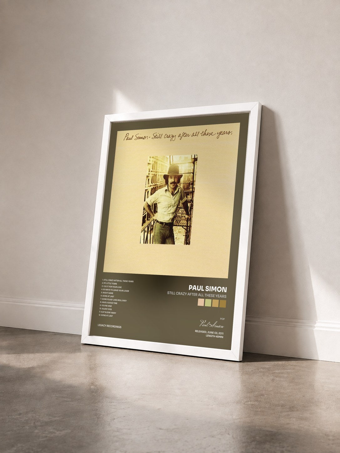 #blanc Tableau de l'album Still Crazy After All These Years de Paul Simon vu de trois quarts, cadre blanc