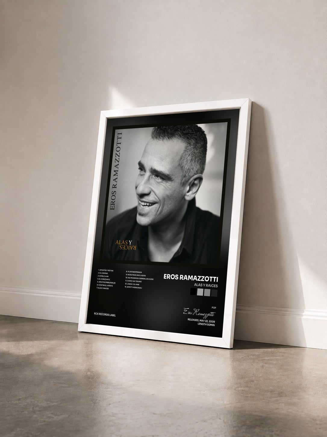 #blanc Tableau de l'album Alas Y Raices de Eros Ramazzotti vu de trois quarts, cadre blanc