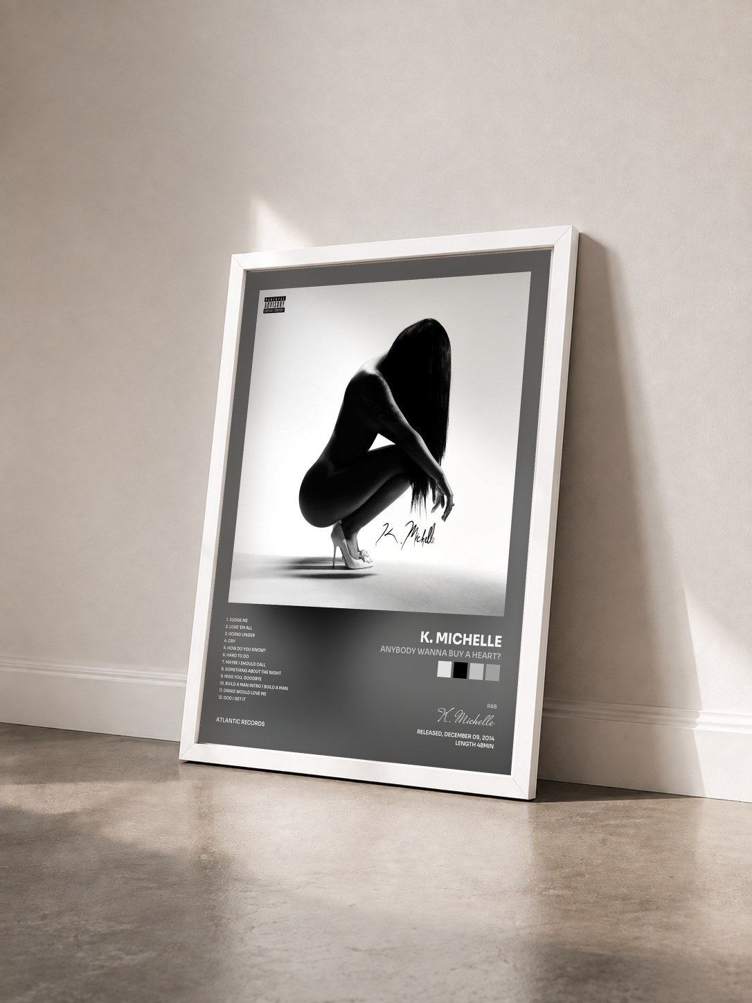 #blanc Tableau de l'album Anybody Wanna Buy a Heart? de K. Michelle vu de trois quarts, cadre blanc