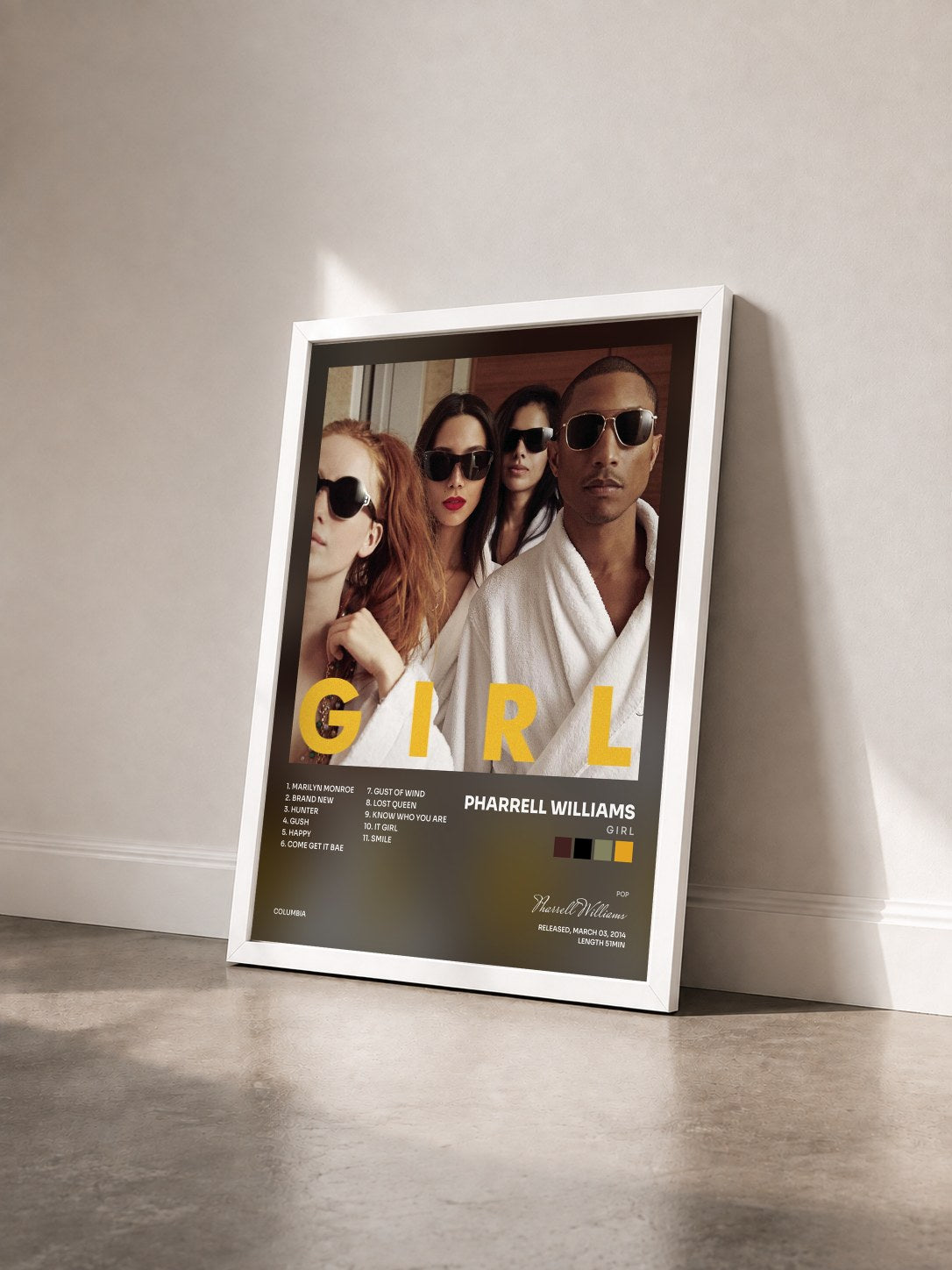 #blanc Tableau de l'album G I R L de Pharrell Williams vu de trois quarts, cadre blanc