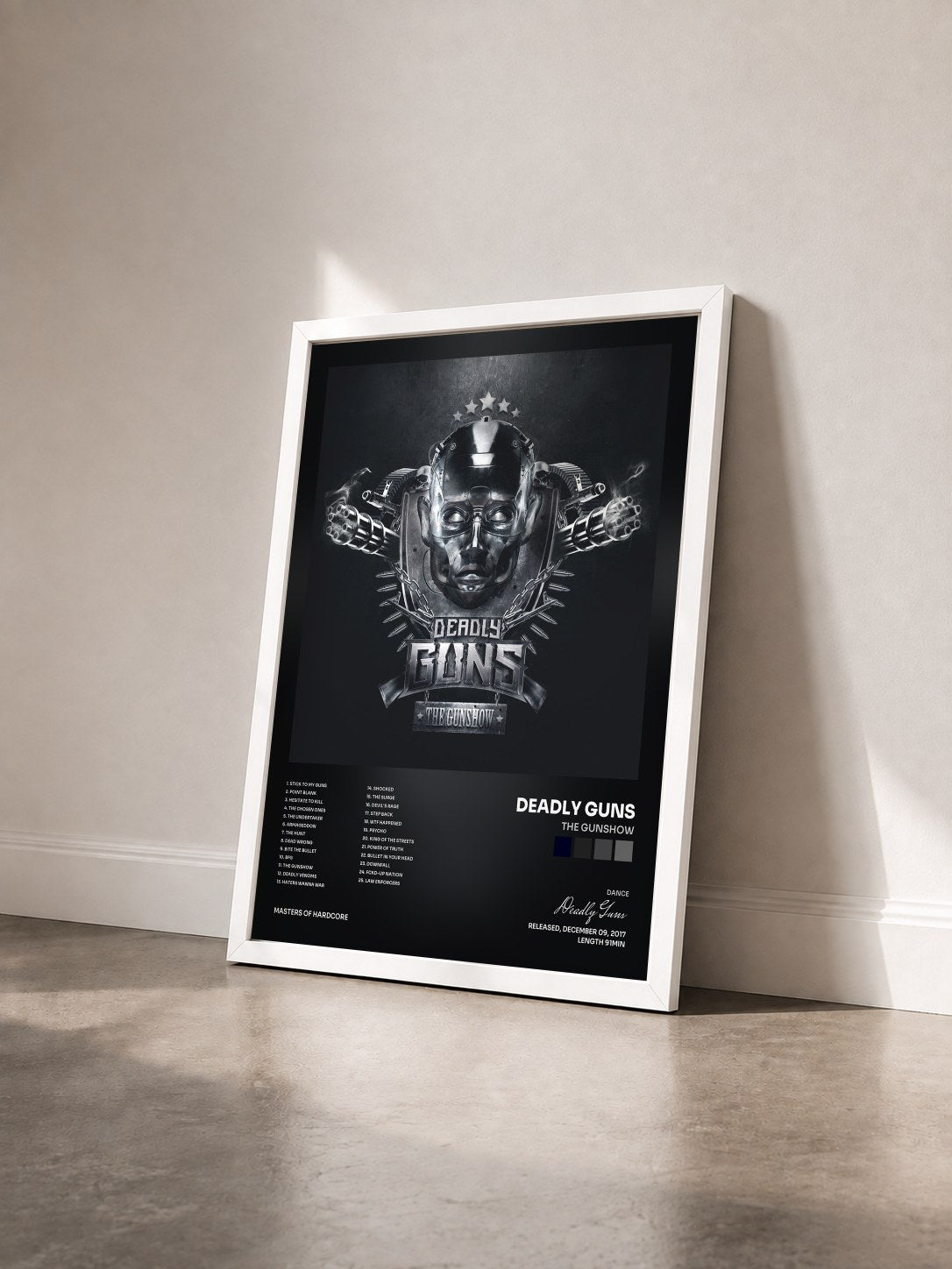 #blanc Tableau de l'album The Gunshow de Deadly Guns vu de trois quarts, cadre blanc