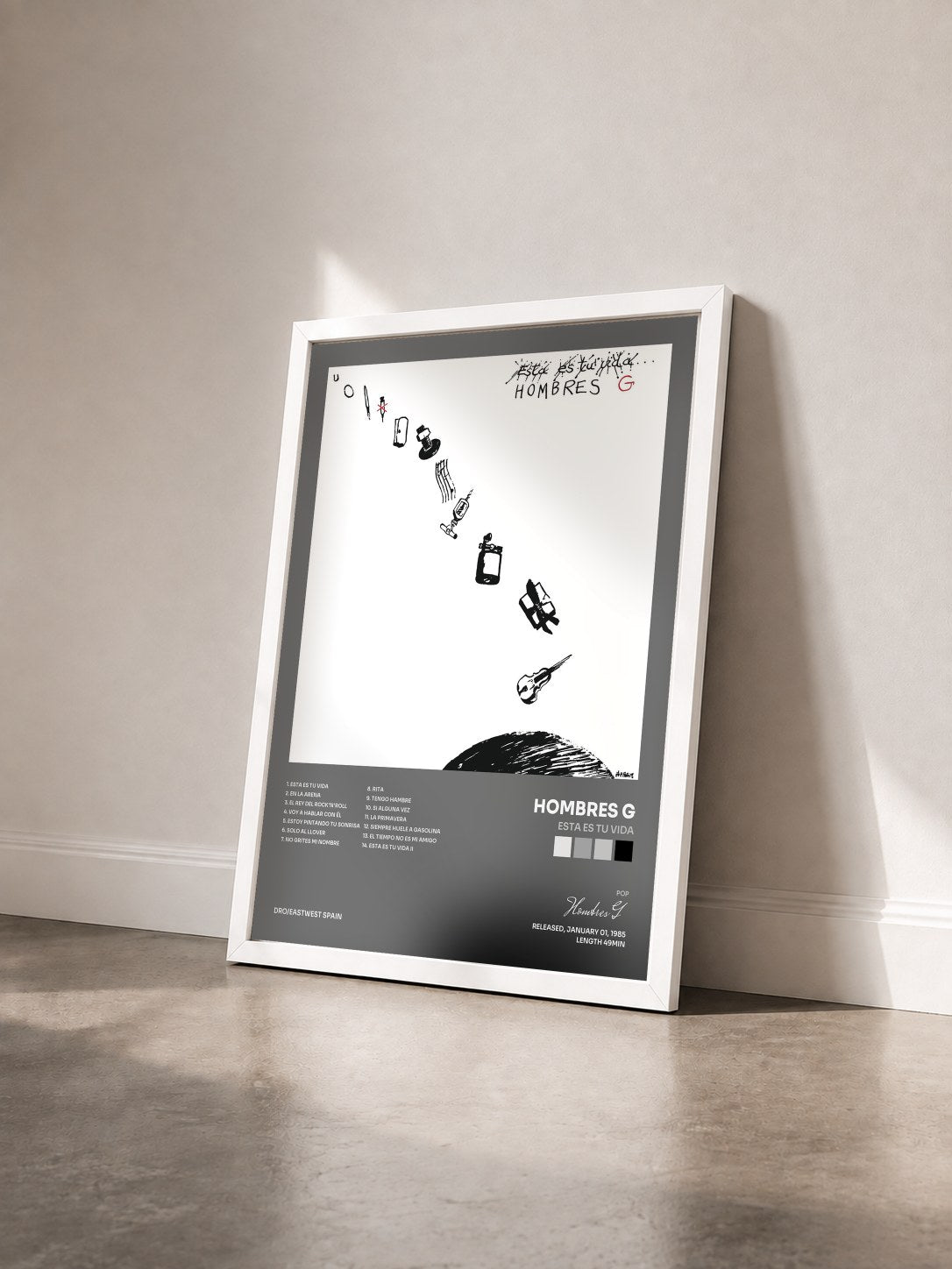 #blanc Tableau de l'album Esta Es Tu Vida de Hombres G vu de trois quarts, cadre blanc