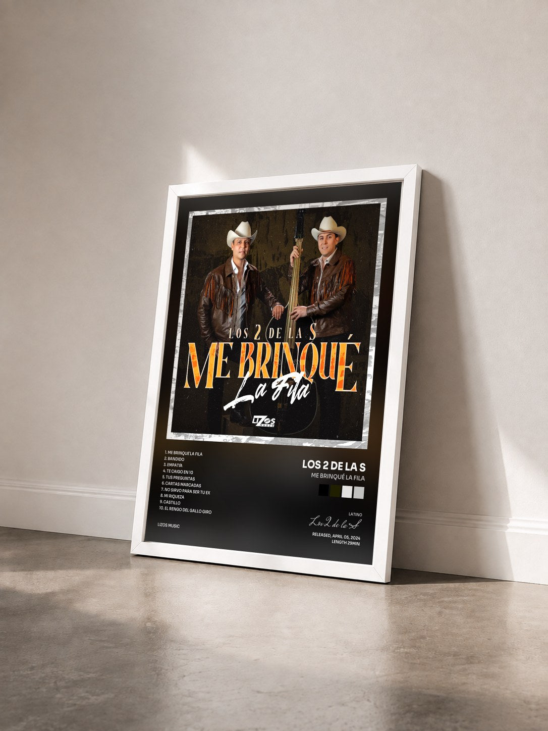 #blanc Tableau de l'album Me Brinqué La Fila de Los 2 de la S vu de trois quarts, cadre blanc
