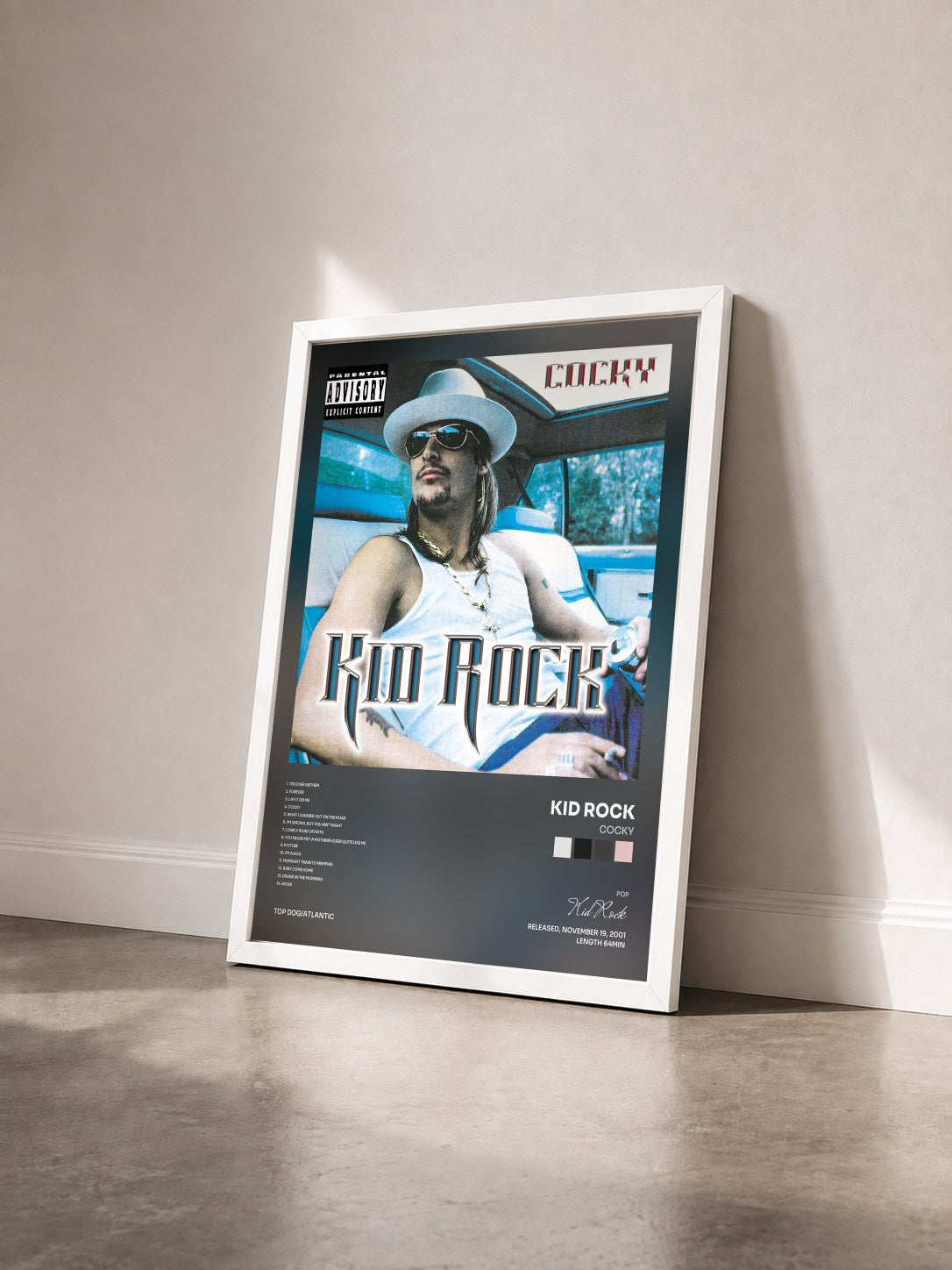 #blanc Tableau de l'album Cocky de Kid Rock vu de trois quarts, cadre blanc