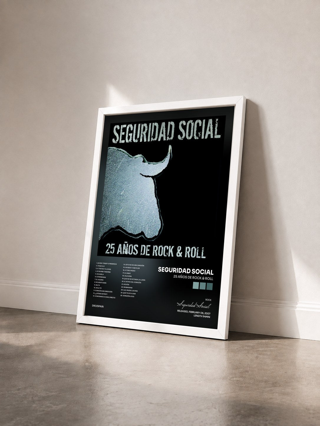 #blanc Tableau de l'album 25 años de Rock & Roll de Seguridad Social vu de trois quarts, cadre blanc