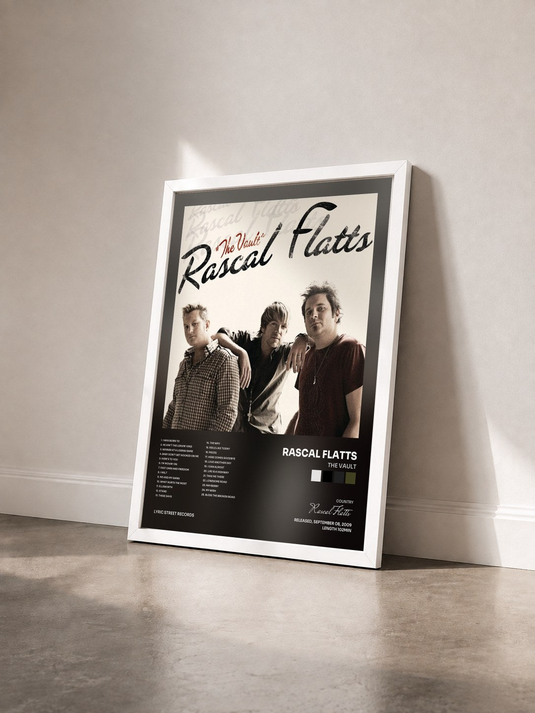 #blanc Tableau de l'album The Vault de Rascal Flatts vu de trois quarts, cadre blanc