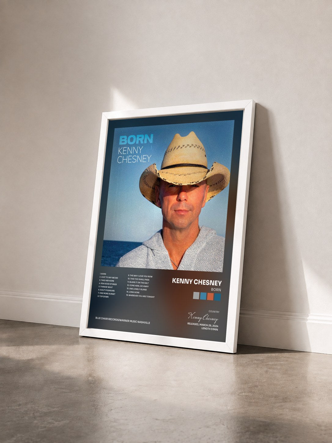 #blanc Tableau de l'album Born de Kenny Chesney vu de trois quarts, cadre blanc