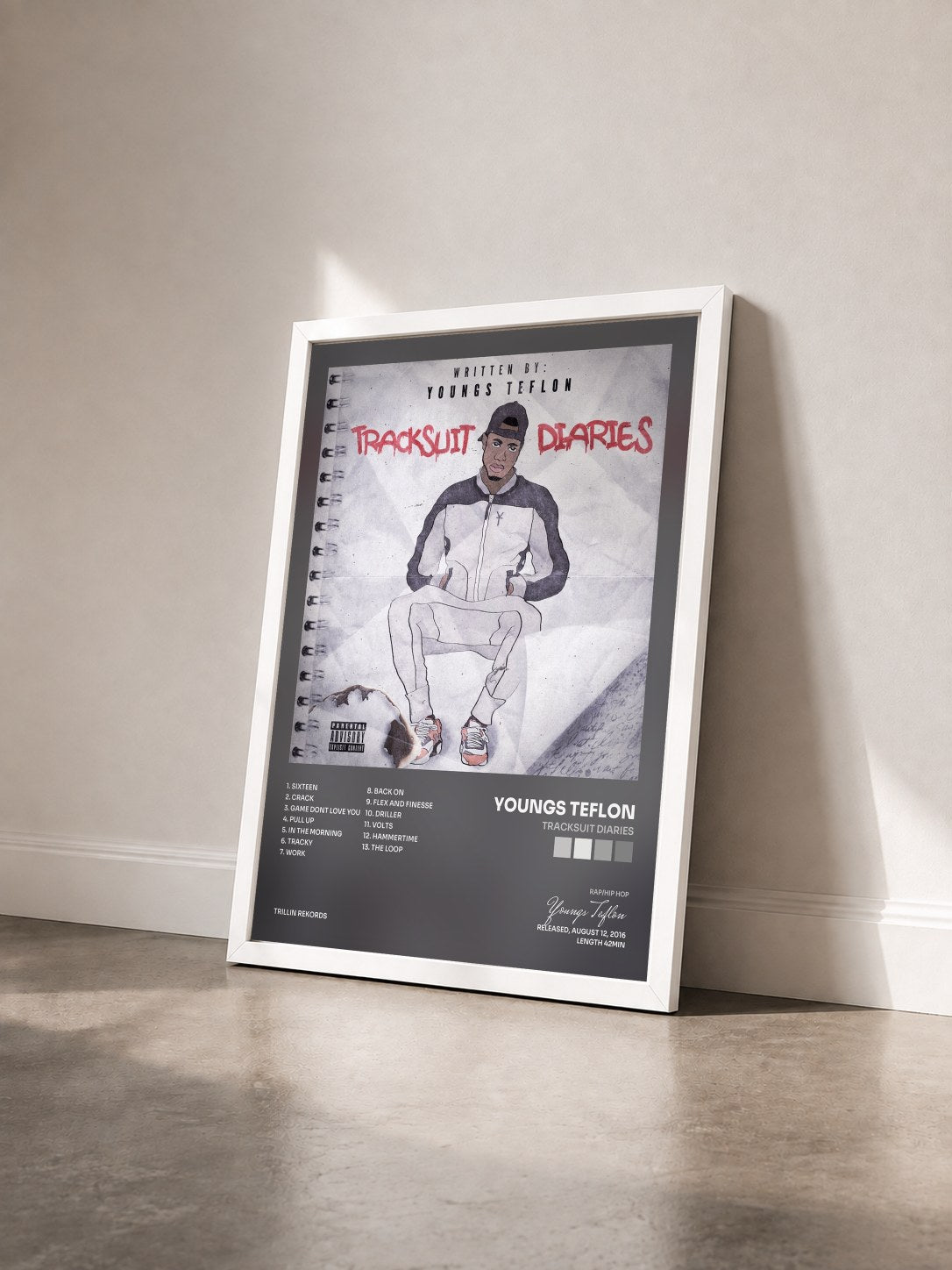 #blanc Tableau de l'album Tracksuit Diaries de Youngs Teflon vu de trois quarts, cadre blanc