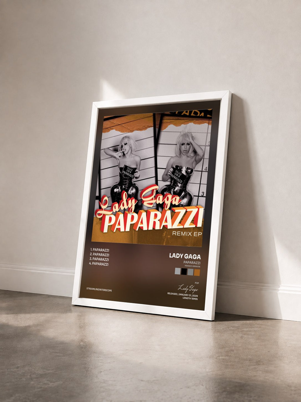 #blanc Tableau de l'album Paparazzi (France Version) de Lady Gaga vu de trois quarts, cadre blanc