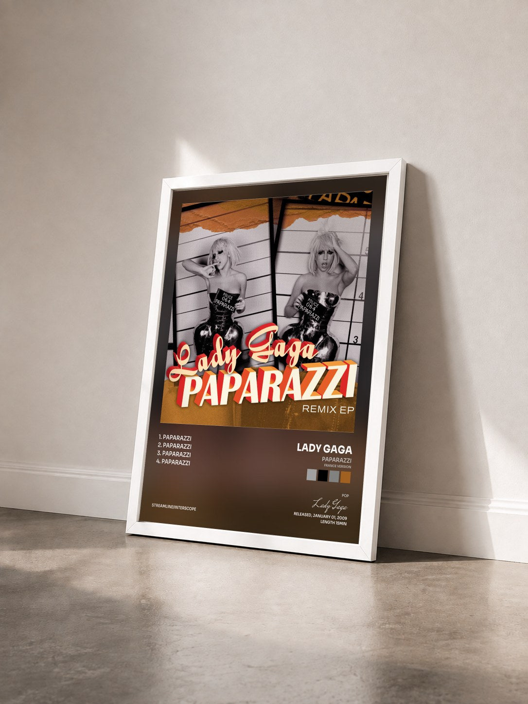 #blanc Tableau de l'album Paparazzi (France Version) de Lady Gaga vu de trois quarts, cadre blanc