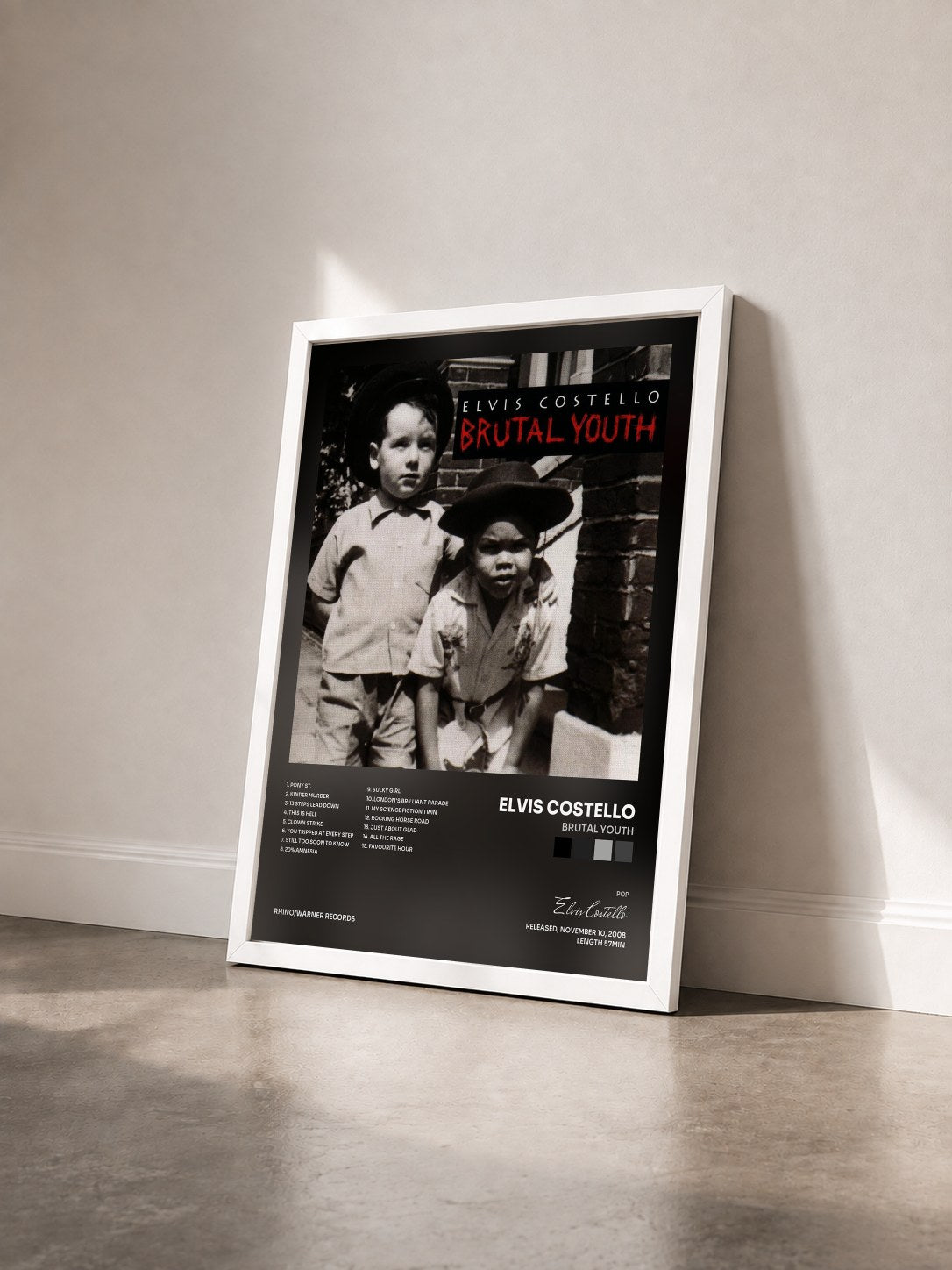 #blanc Tableau de l'album Brutal Youth de Elvis Costello vu de trois quarts, cadre blanc