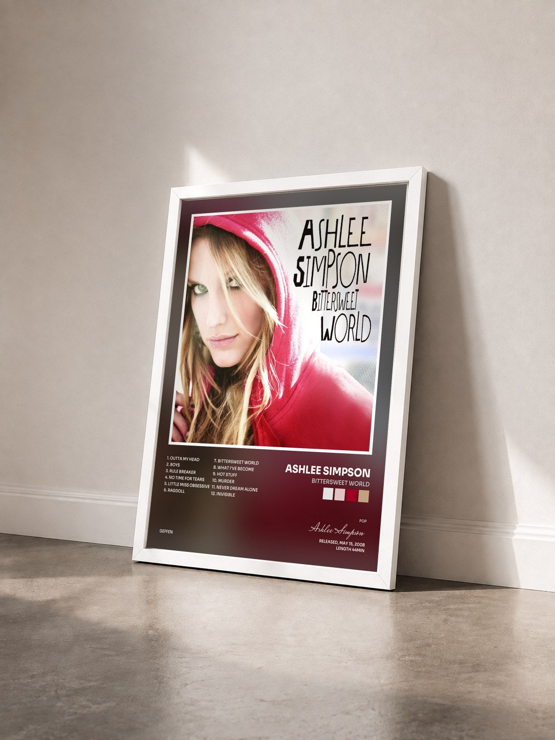 #blanc Tableau de l'album Bittersweet World de Ashlee Simpson vu de trois quarts, cadre blanc