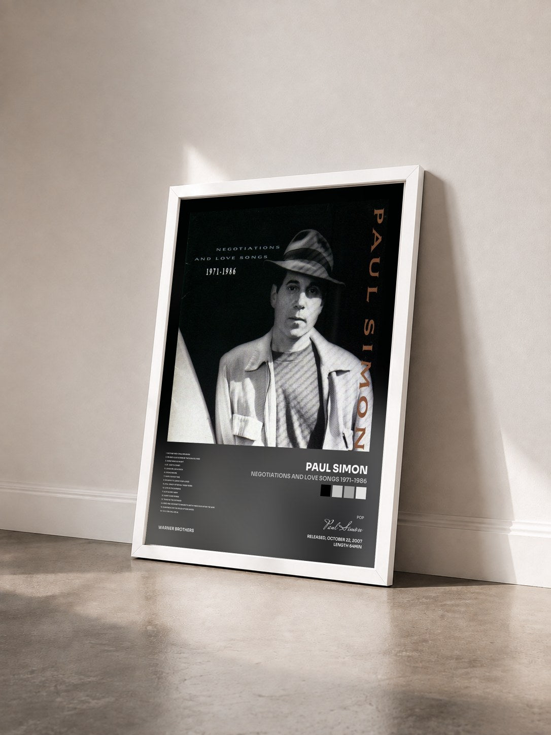 #blanc Tableau de l'album Negotiations And Love Songs 1971-1986 de Paul Simon vu de trois quarts, cadre blanc