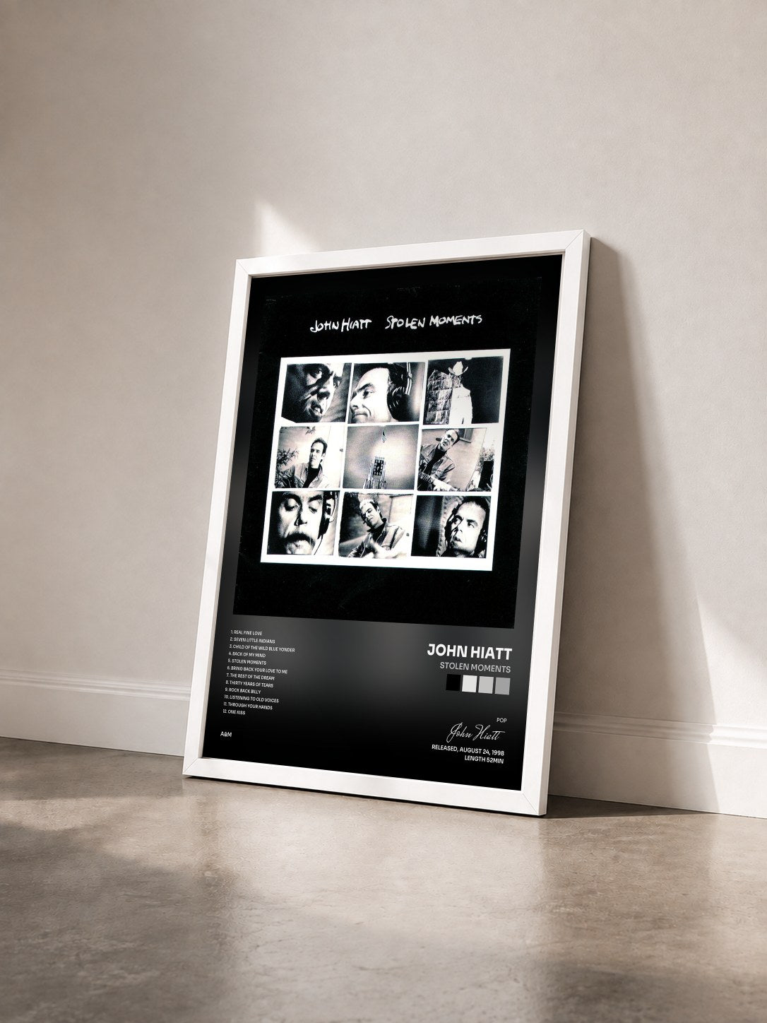 #blanc Tableau de l'album Stolen Moments de John Hiatt vu de trois quarts, cadre blanc