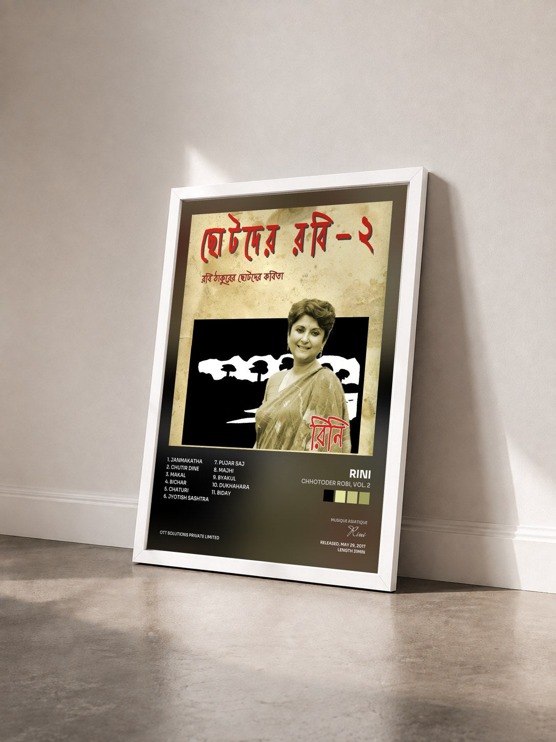 #blanc Tableau de l'album Chhotoder Robi, Vol. 2 de Rini vu de trois quarts, cadre blanc