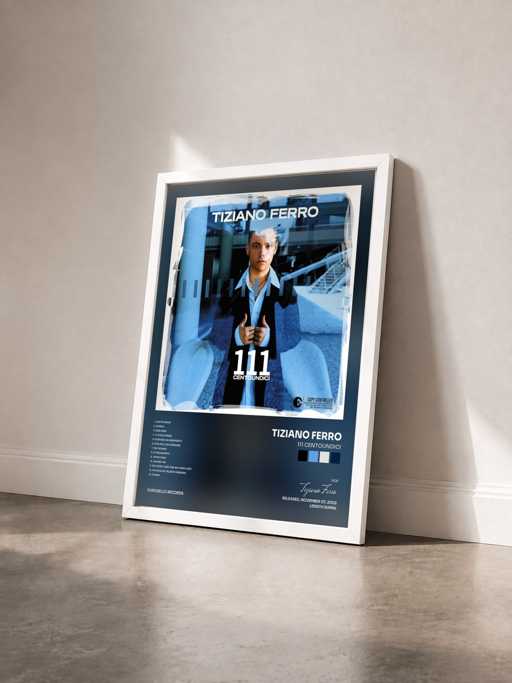 #blanc 111 Centoundici by Tiziano Ferro as a framed art print seen at an angle, white frame