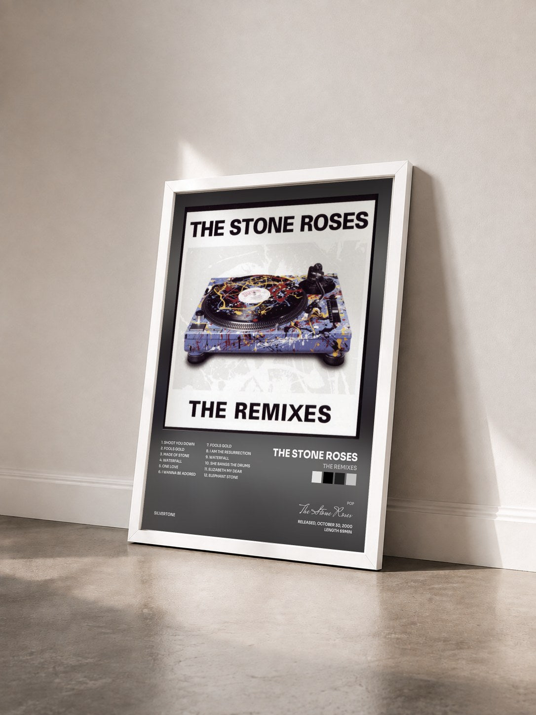 #blanc Tableau de l'album The Remixes de The Stone Roses vu de trois quarts, cadre blanc
