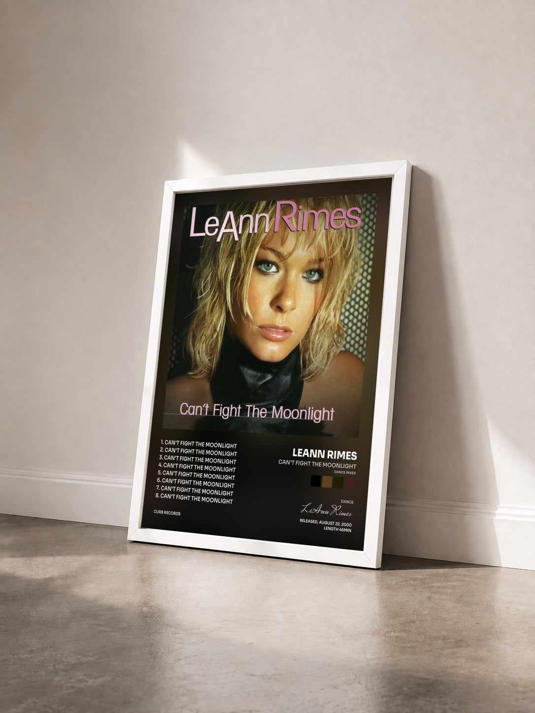 #blanc Tableau de l'album Can't Fight The Moonlight (Dance Mixes) de LeAnn Rimes vu de trois quarts, cadre blanc