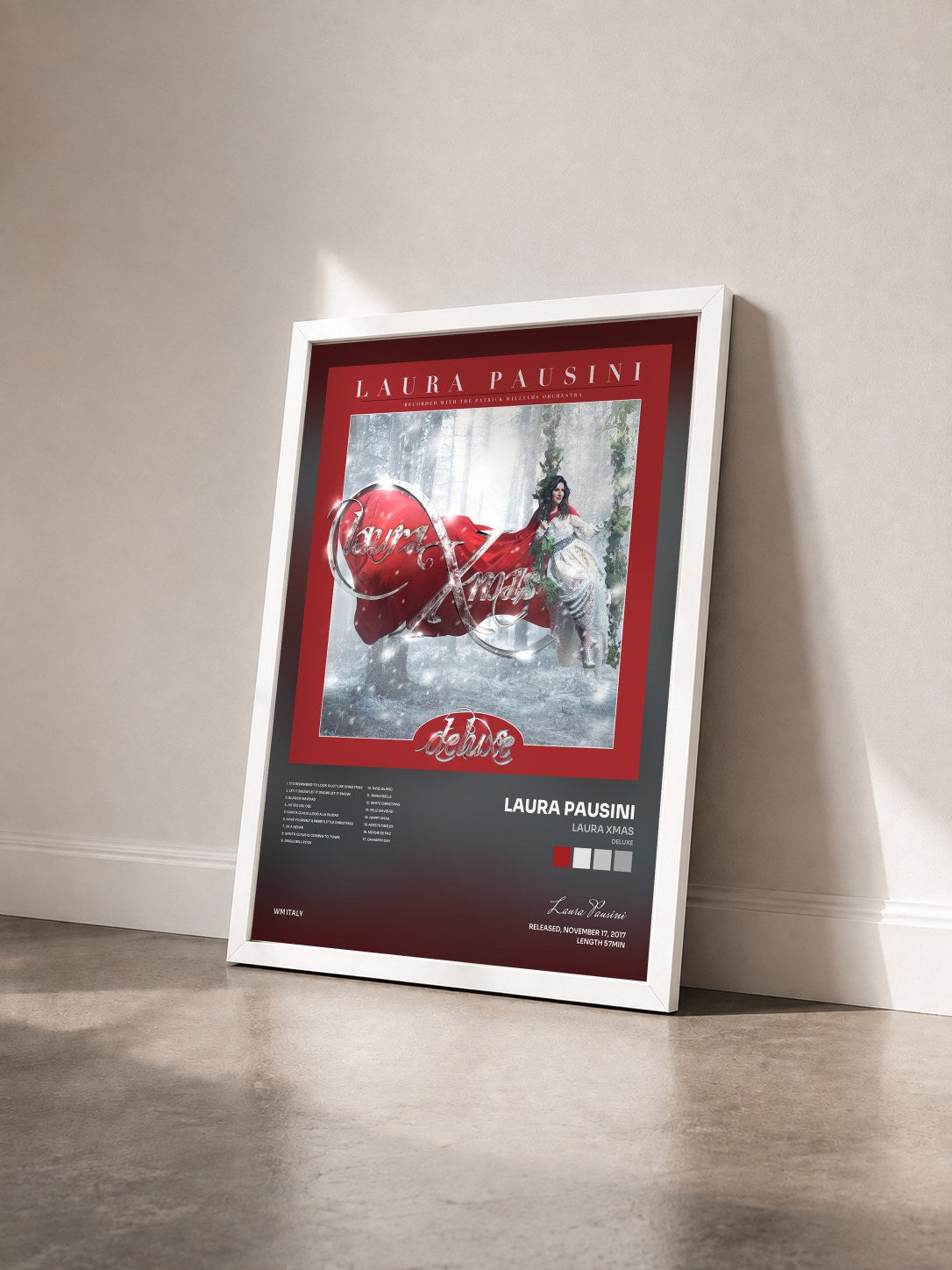 #blanc Tableau de l'album Laura Xmas (Deluxe) de Laura Pausini vu de trois quarts, cadre blanc