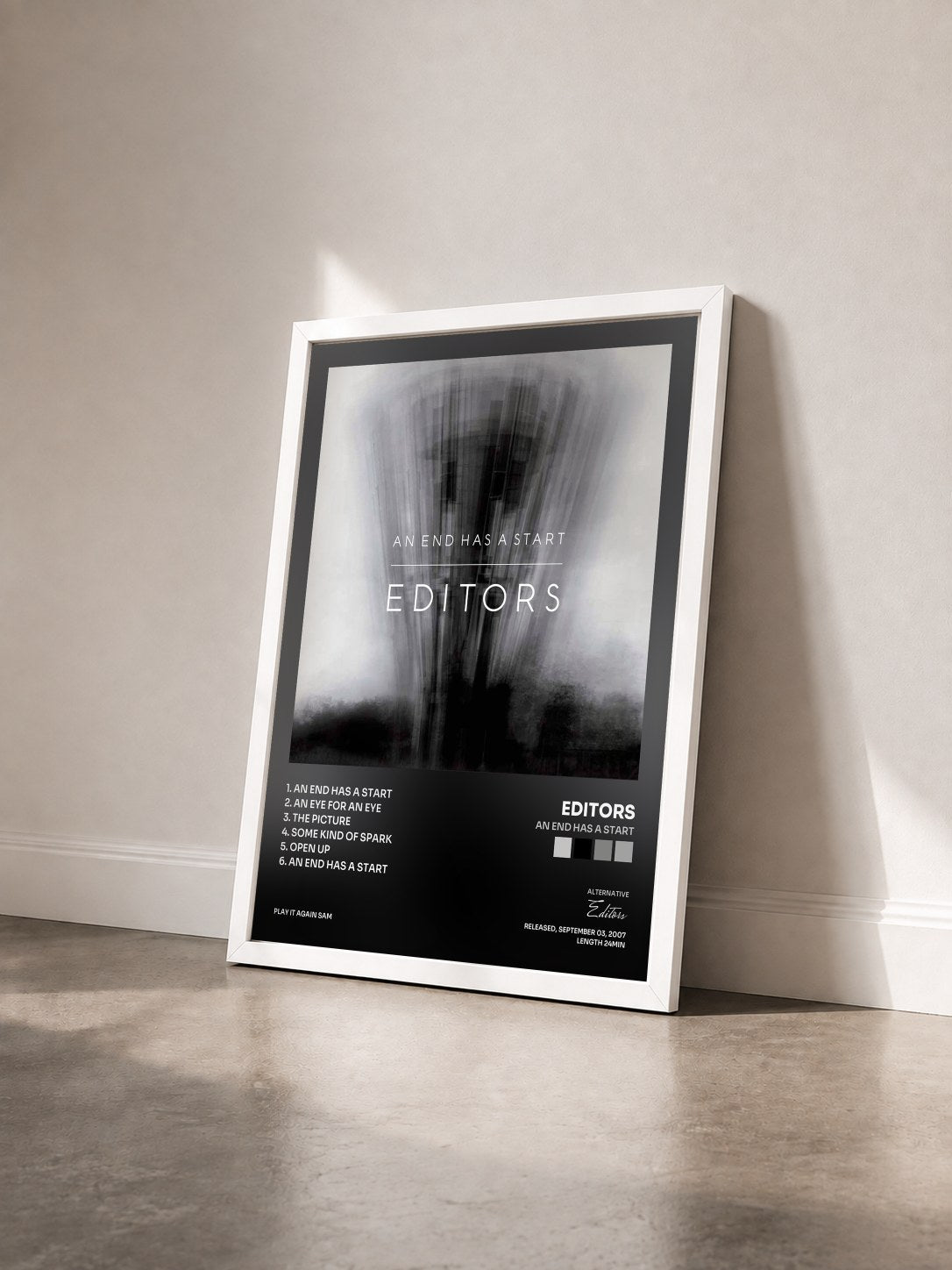 #blanc Tableau de l'album An End Has A Start de Editors vu de trois quarts, cadre blanc