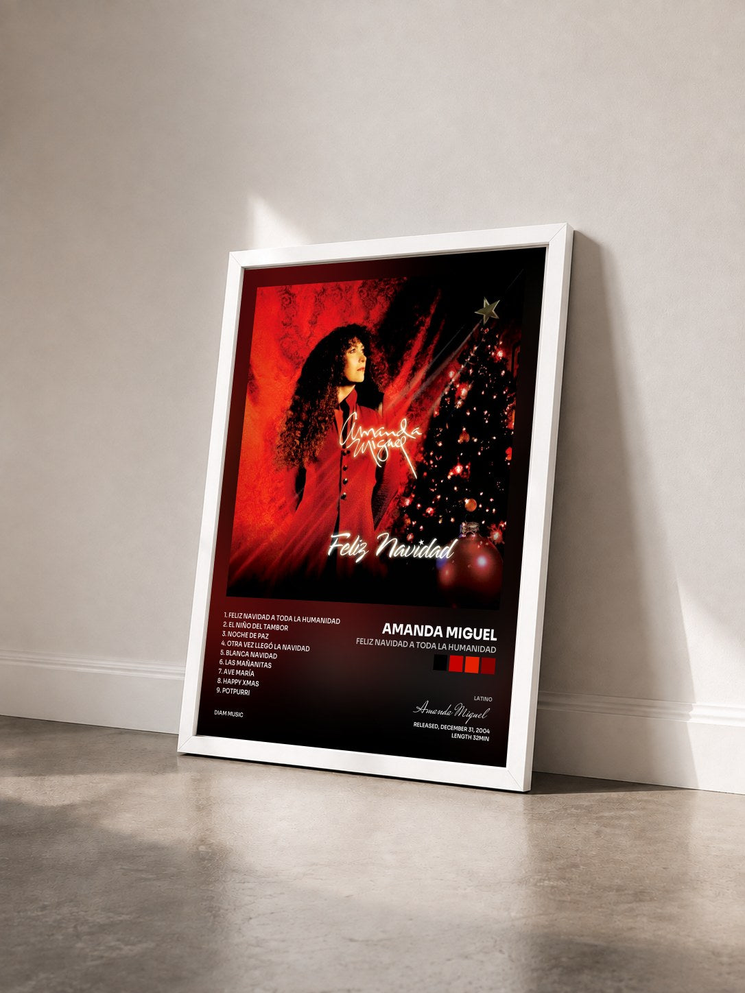 #blanc Tableau de l'album Feliz Navidad A Toda La Humanidad de Amanda Miguel vu de trois quarts, cadre blanc
