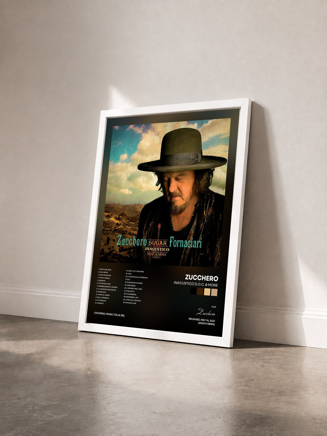 #blanc Tableau de l'album INACUSTICO D.O.C. & MORE de Zucchero vu de trois quarts, cadre blanc