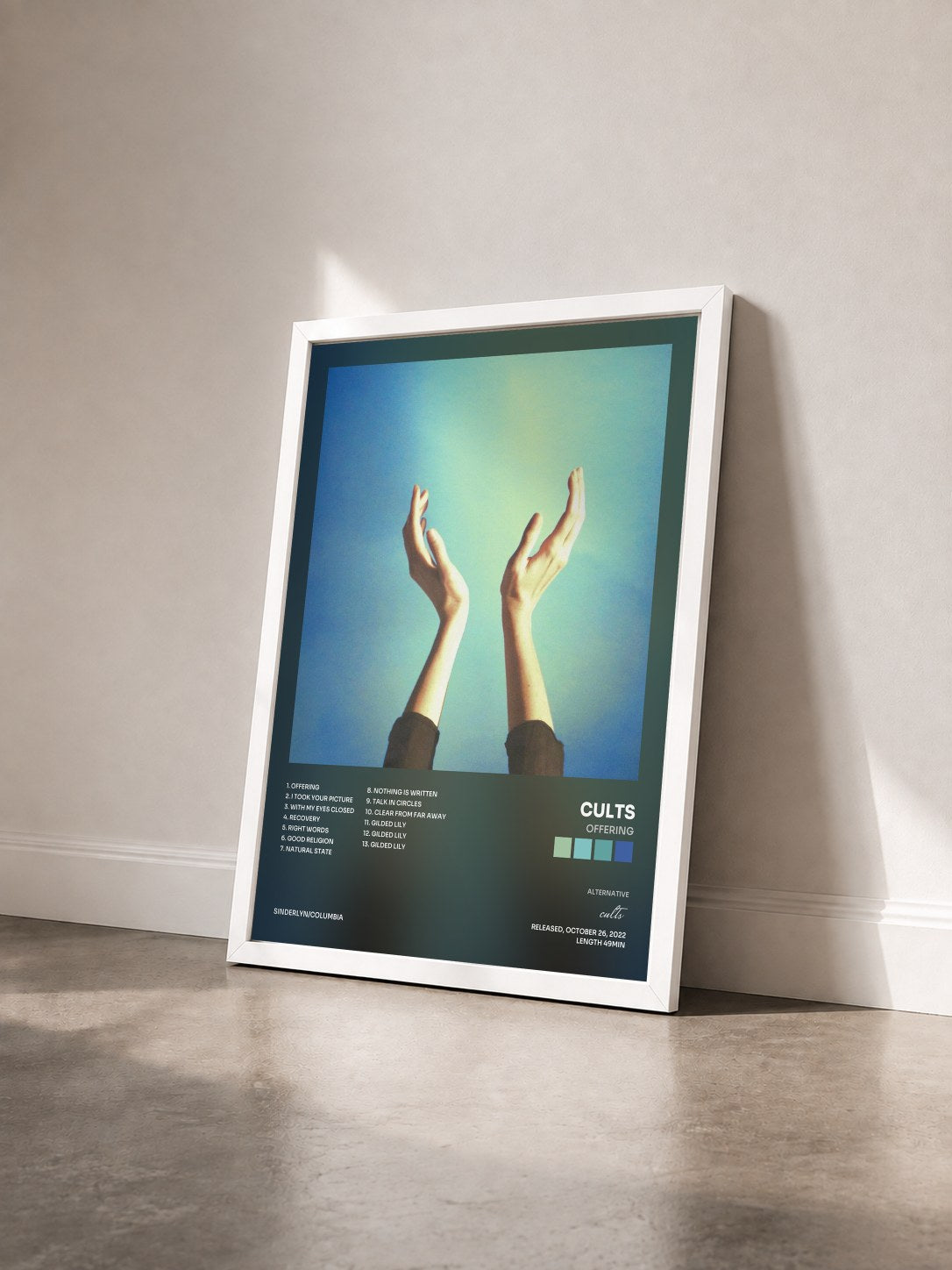 #blanc Tableau de l'album Offering de cults vu de trois quarts, cadre blanc