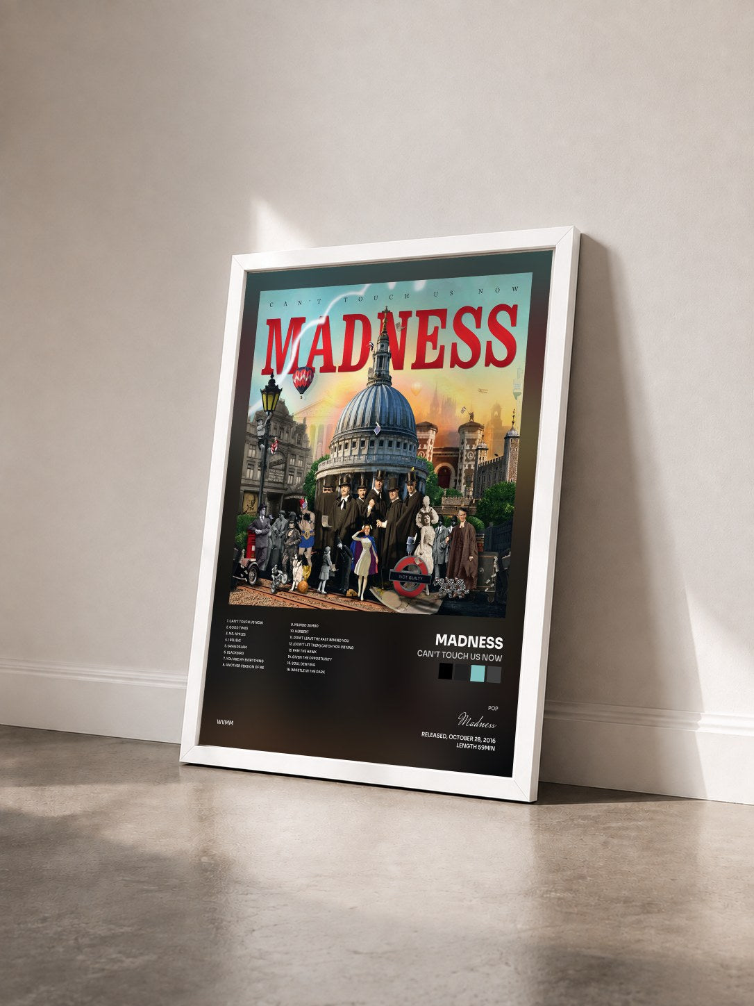 #blanc Tableau de l'album Can't Touch Us Now de Madness vu de trois quarts, cadre blanc