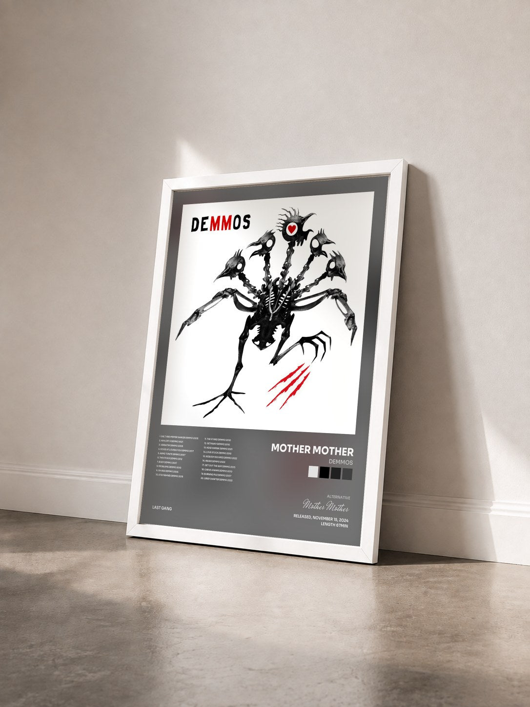 #blanc Tableau de l'album DEMMOS de Mother Mother vu de trois quarts, cadre blanc