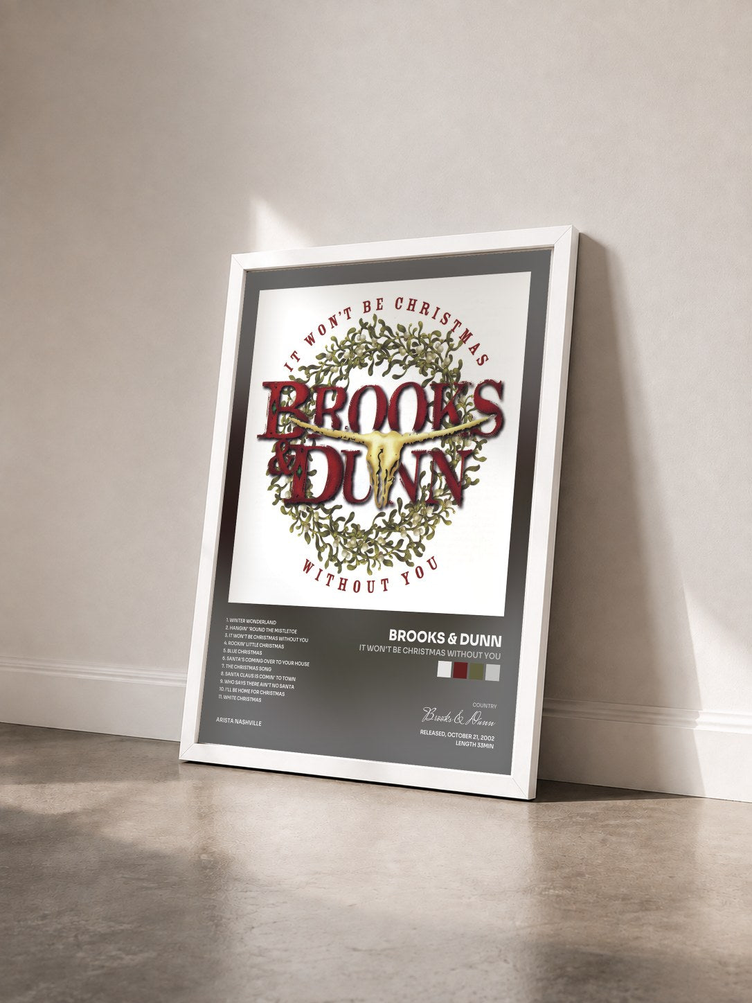 #blanc Tableau de l'album It Won't Be Christmas Without You de Brooks & Dunn vu de trois quarts, cadre blanc