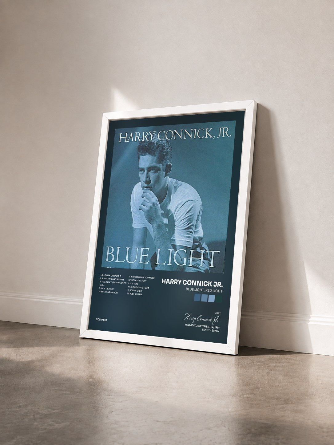#blanc Tableau de l'album Blue Light, Red Light de Harry Connick Jr. vu de trois quarts, cadre blanc