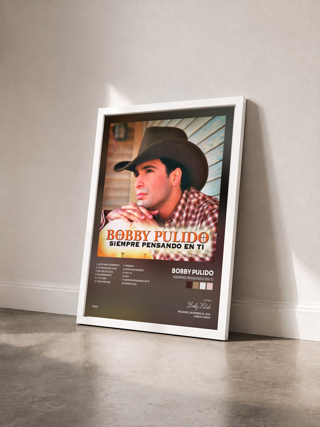 #blanc Tableau de l'album Siempre Pensando En Ti de Bobby Pulido vu de trois quarts, cadre blanc
